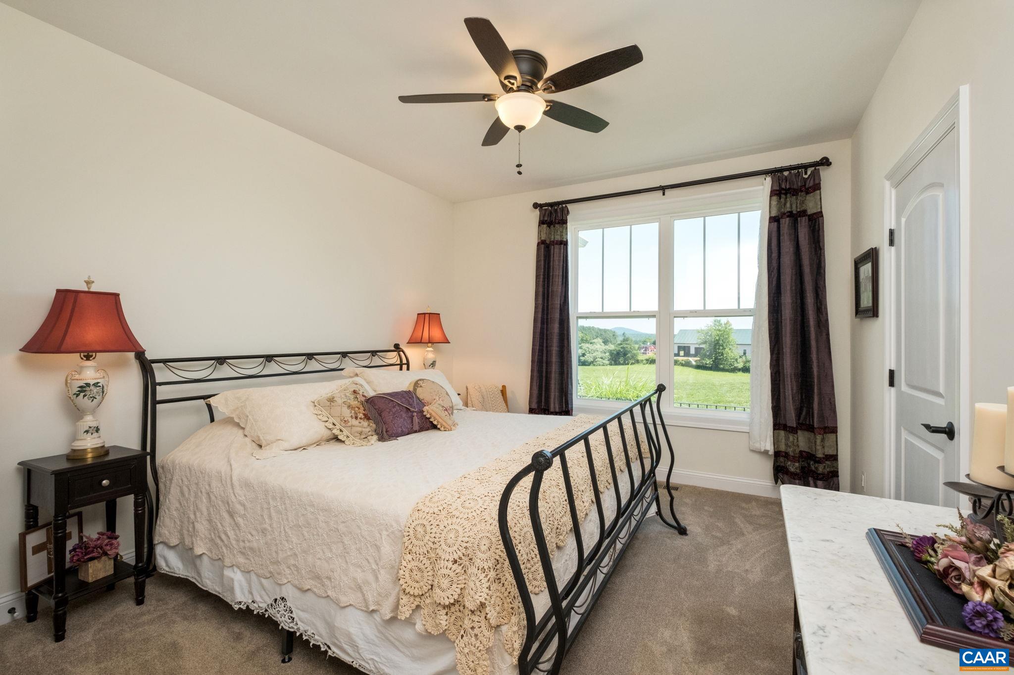 This main level bedroom is located off of the back hallway, and shares a full bathroom with another bedroom. This main level bedroom is located off of the back hallway, and shares a full bathroom with another bedroom.