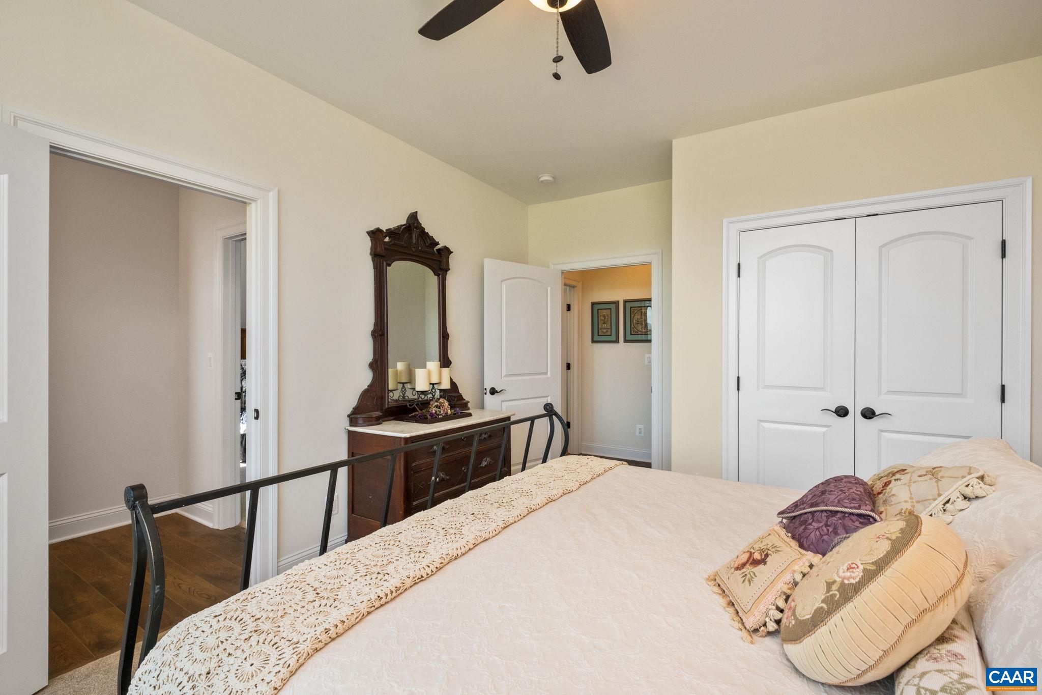 This main level bedroom is located off of the back hallway, and shares a full bathroom with another bedroom. This main level bedroom is located off of the back hallway, and shares a full bathroom with another bedroom.