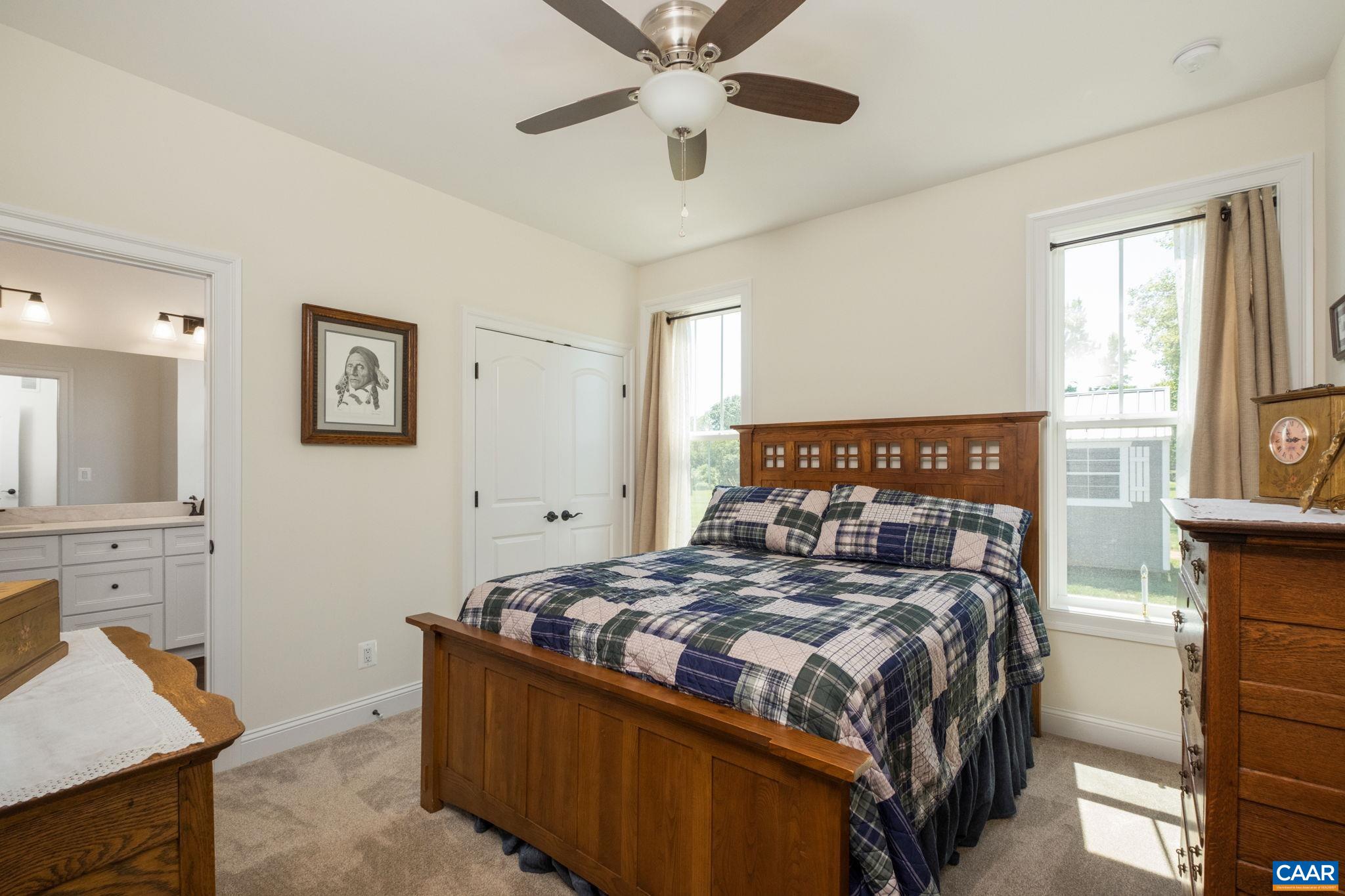 This main level bedroom is located off of the back hallway, and shares a full bathroom with another bedroom. This main level bedroom is located off of the back hallway, and shares a full bathroom with another bedroom.