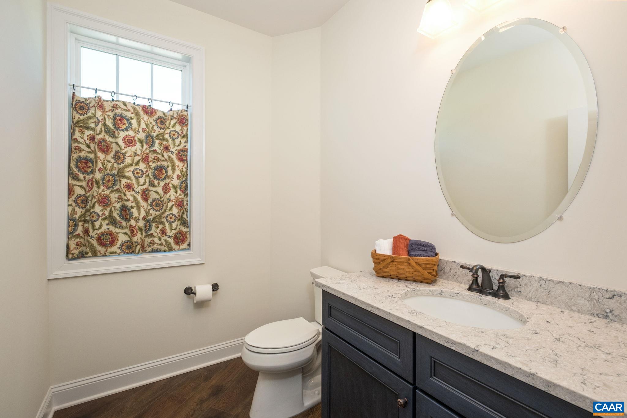 This half bath is just off of the back hallway. This half bath is just off of the back hallway.