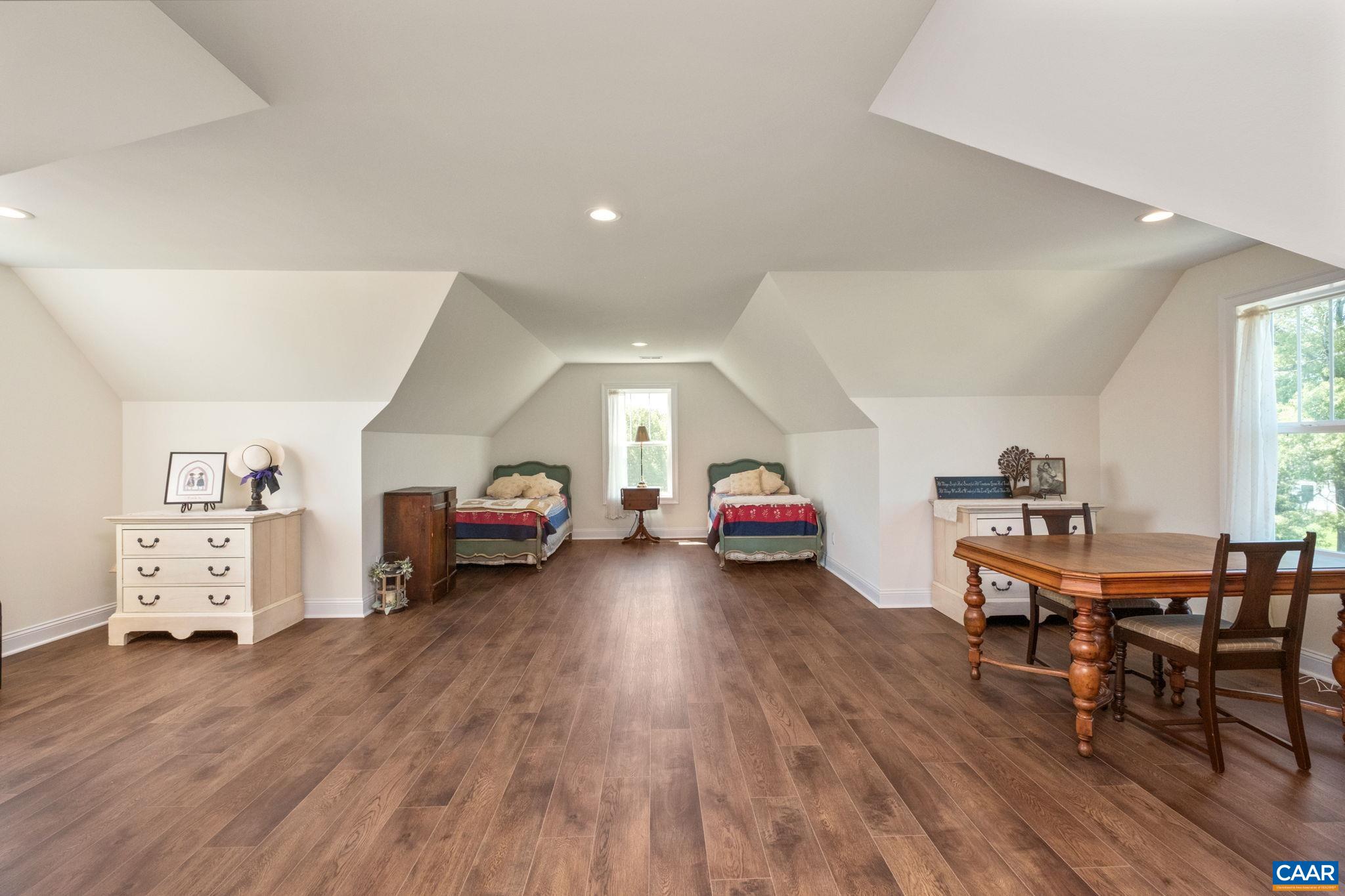 This versatile and multi-use space is on the second level and is currently used as a guest room with sitting area, storage, a sewing area. This versatile and multi-use space is on the second level and is currently used as a guest room with sitting area, storage, a sewing area.