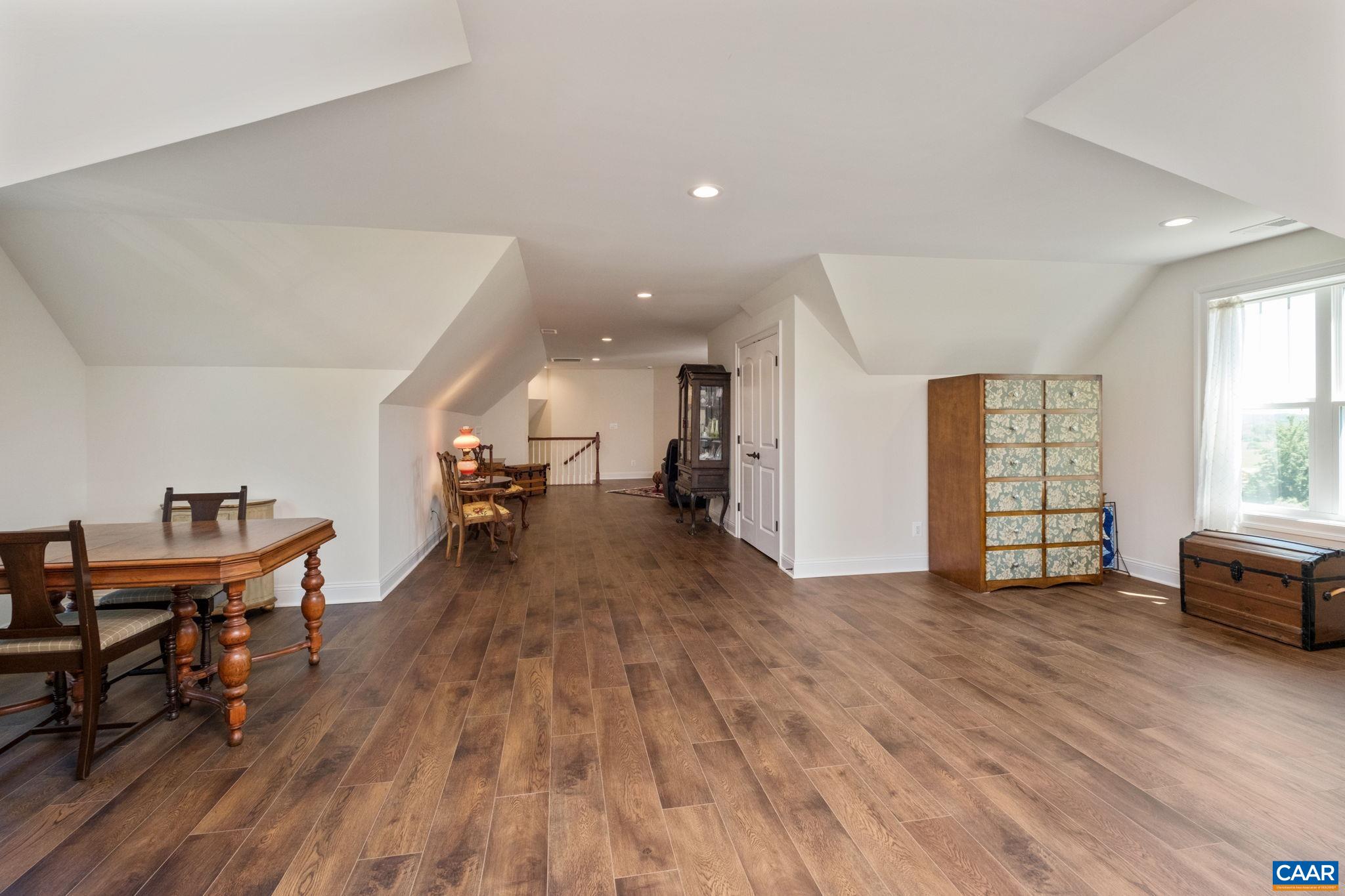 This versatile and multi-use space is on the second level and is currently used as a guest room with sitting area, storage, a sewing area. This versatile and multi-use space is on the second level and is currently used as a guest room with sitting area, storage, a sewing area.