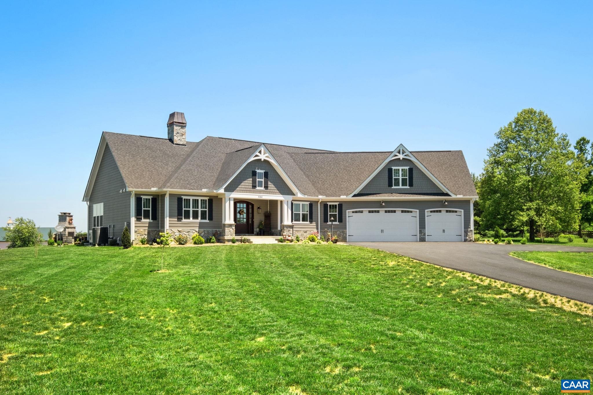 The home is elevated above the road, and mostly flat from the home to the backyard. The home is elevated above the road, and mostly flat from the home to the backyard.