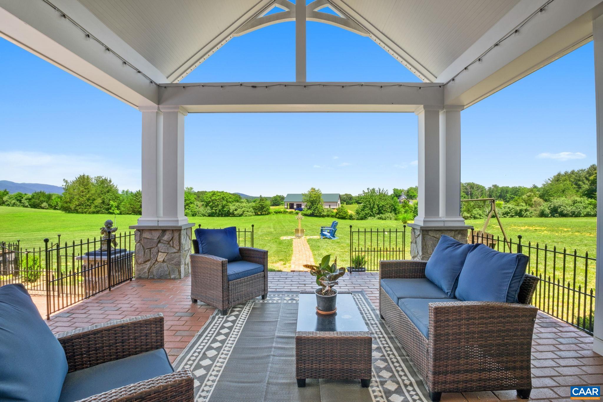The views are lovely from the covered back porch! This is from the living room French doors looking to the covered back porch. The views are lovely from the covered back porch! This is from the living room French doors looking to the covered back porch.