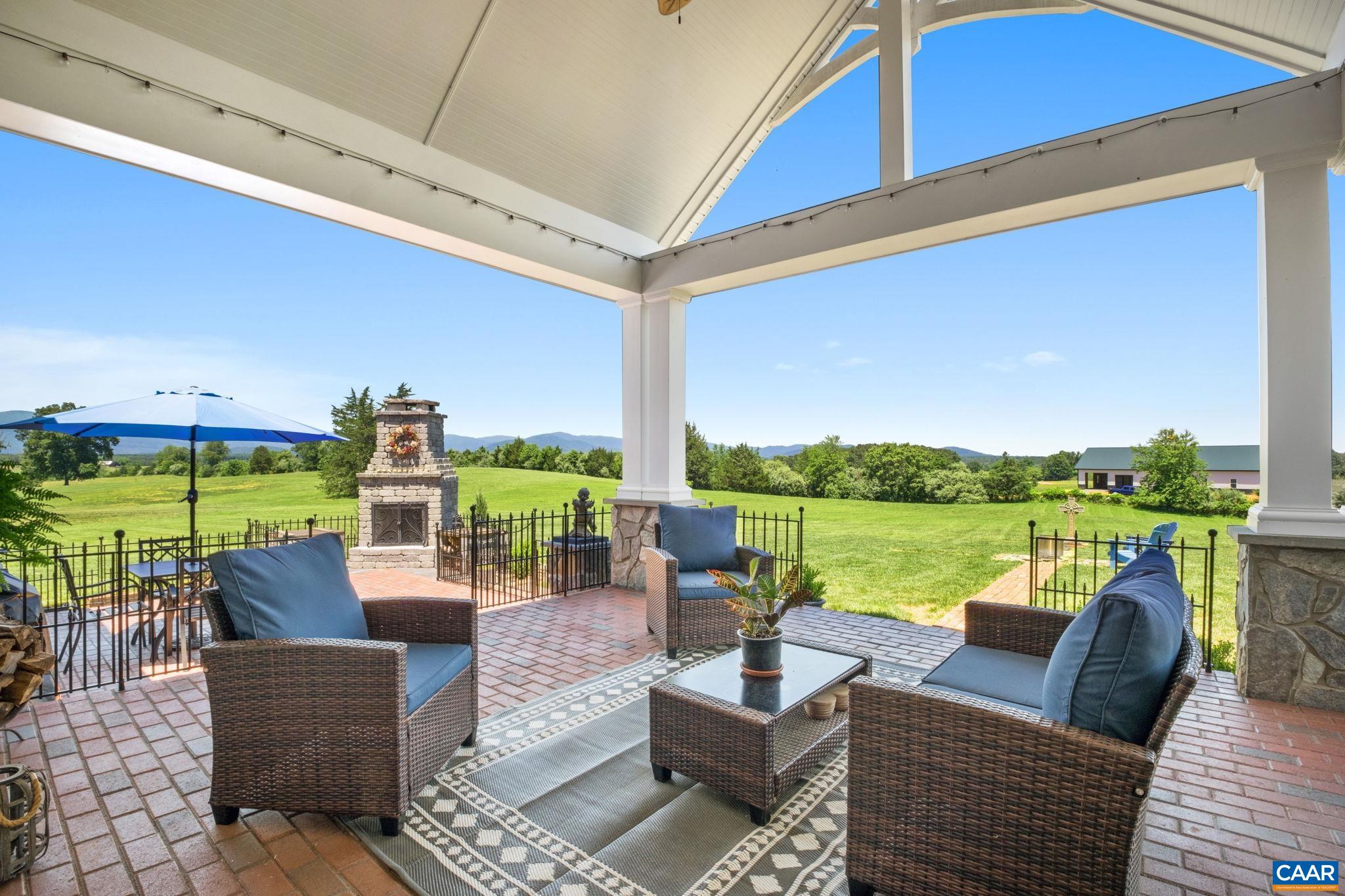 The covered back porch has expansive views of the mountains. The covered back porch has expansive views of the mountains.