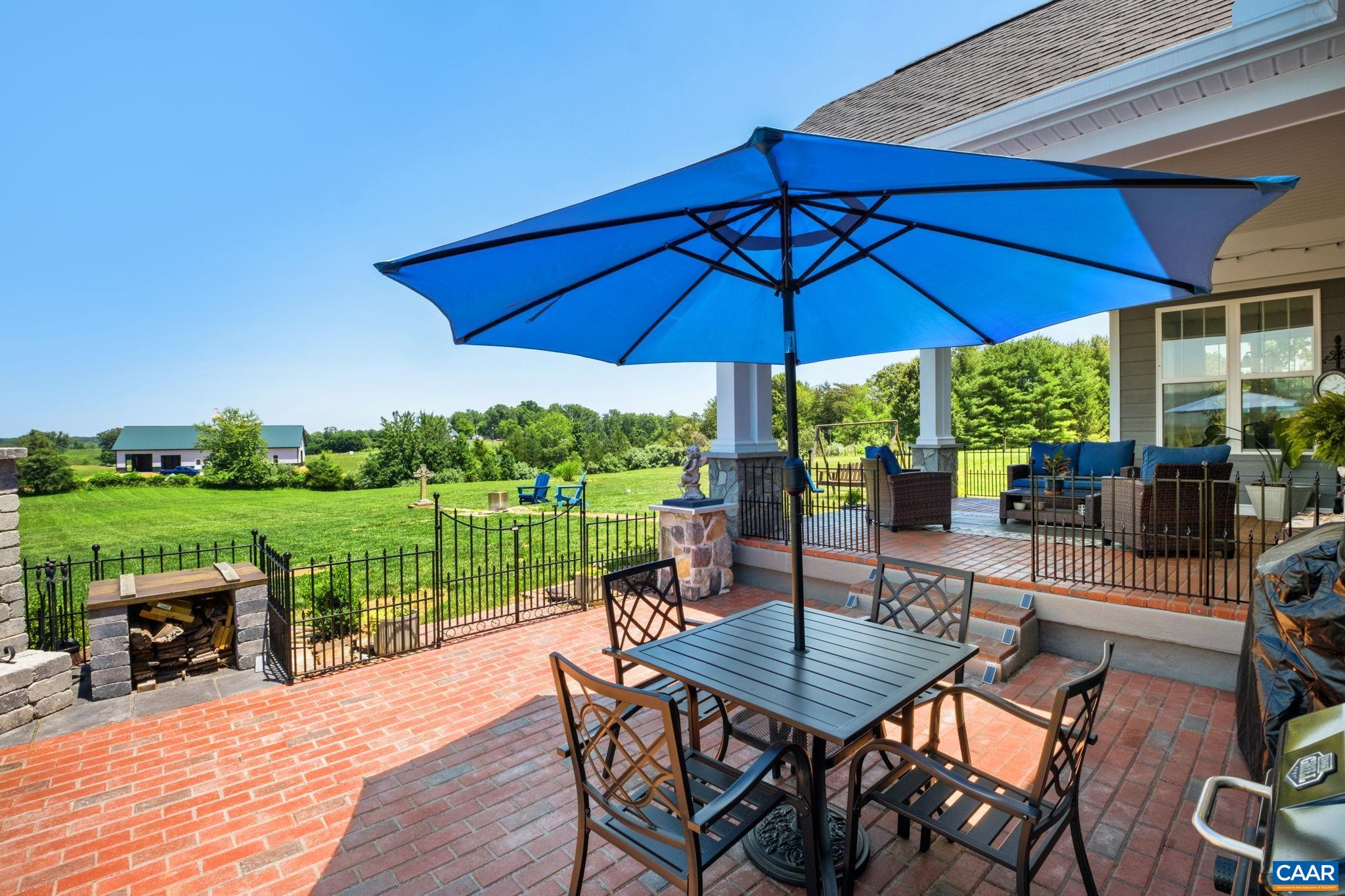 This patio includes an outdoor stone fireplace. This patio includes an outdoor stone fireplace.