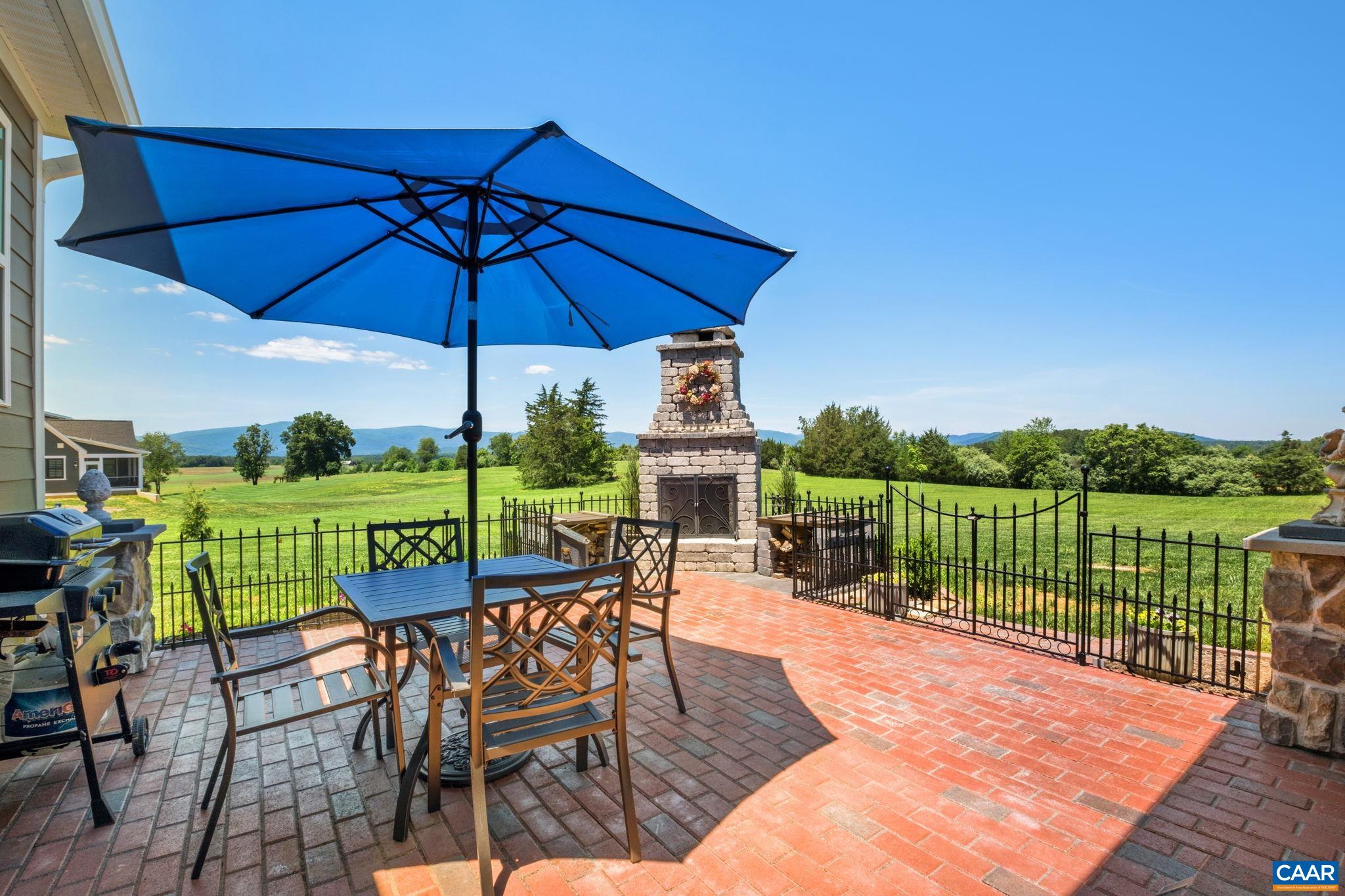 This patio includes an outdoor stone fireplace. This patio includes an outdoor stone fireplace.