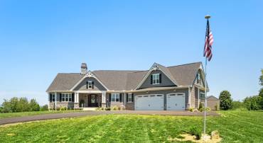 Built by True Living, the exterior features real stone and Hardie Plank.  Home has a 3-car garage.