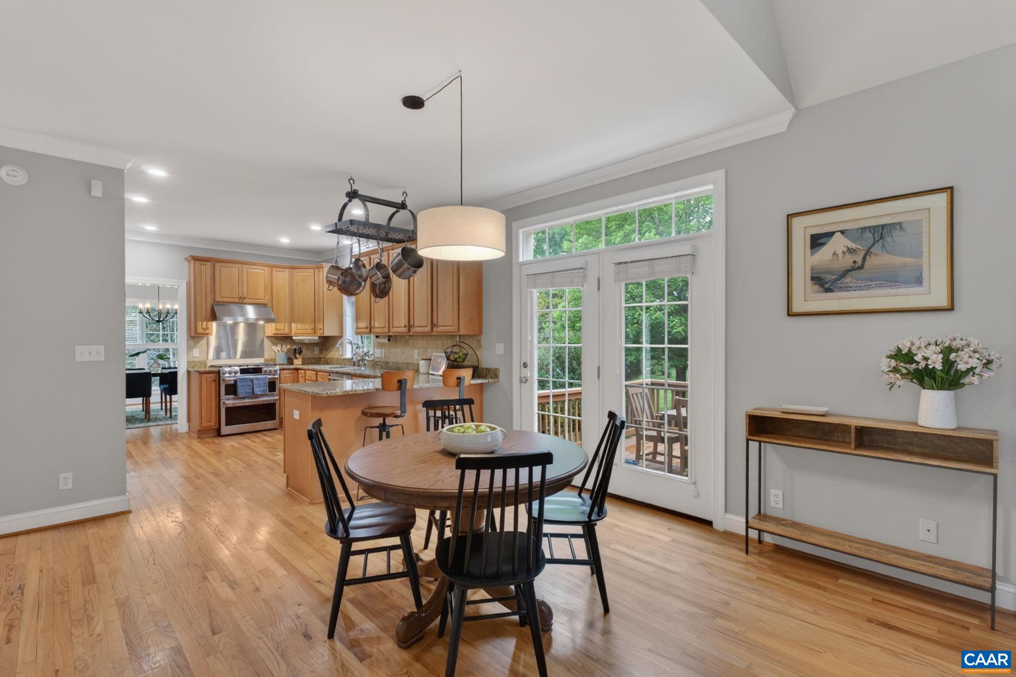 Kitchen and family room open out onto deck with steps to yard Kitchen and family room open out onto deck with steps to yard