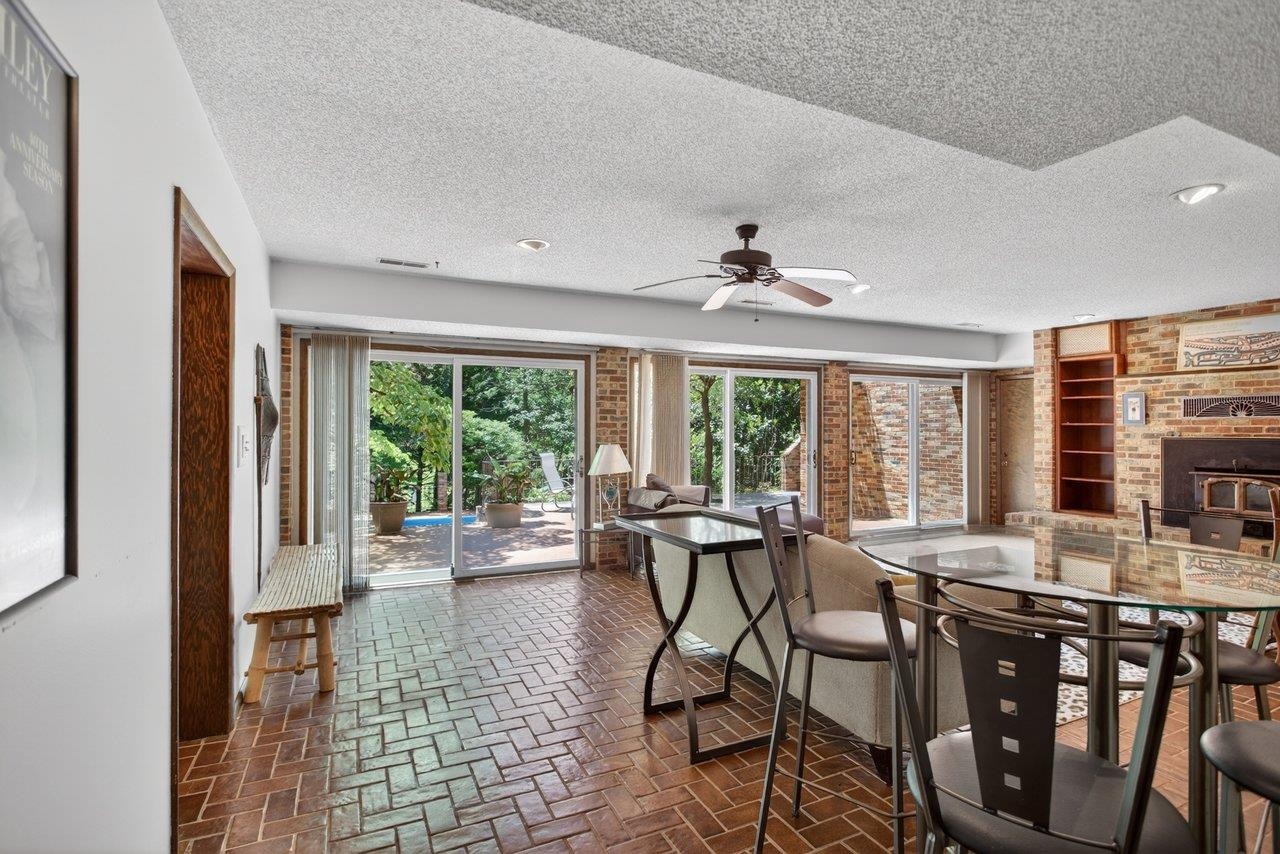 The family room is on the lower level and opens out to the expansive patio The family room is on the lower level and opens out to the expansive patio