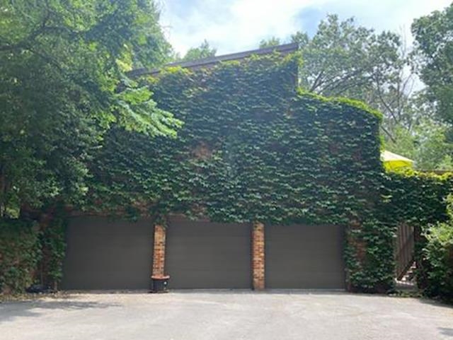 There is lots of room for storage in this oversized garage that easily holds 3 vehicles There is lots of room for storage in this oversized garage that easily holds 3 vehicles