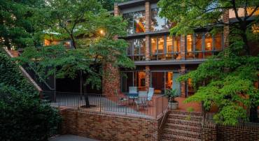 This lovely home is tucked away on 1.4 private acres