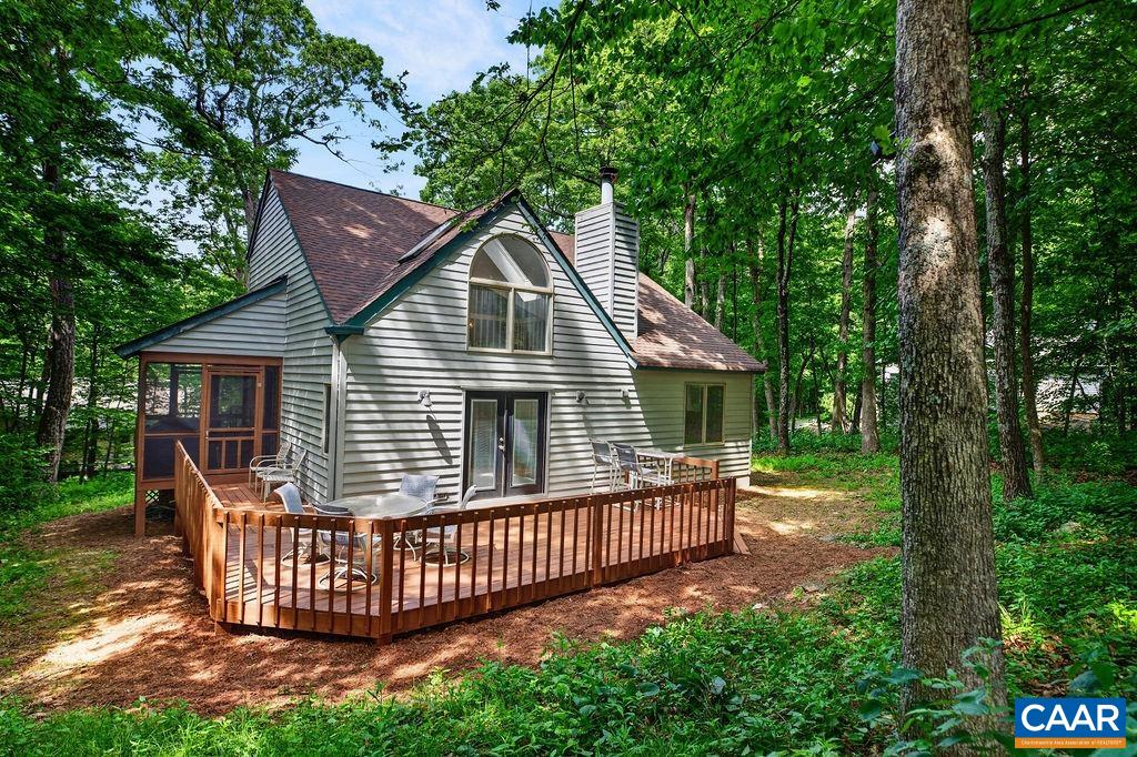 The home features a screened porch and a generously sized rear deck, perfect for relaxing and enjoying the mountain setting and the golf fairway views. The home features a screened porch and a generously sized rear deck, perfect for relaxing and enjoying the mountain setting and the golf fairway views.