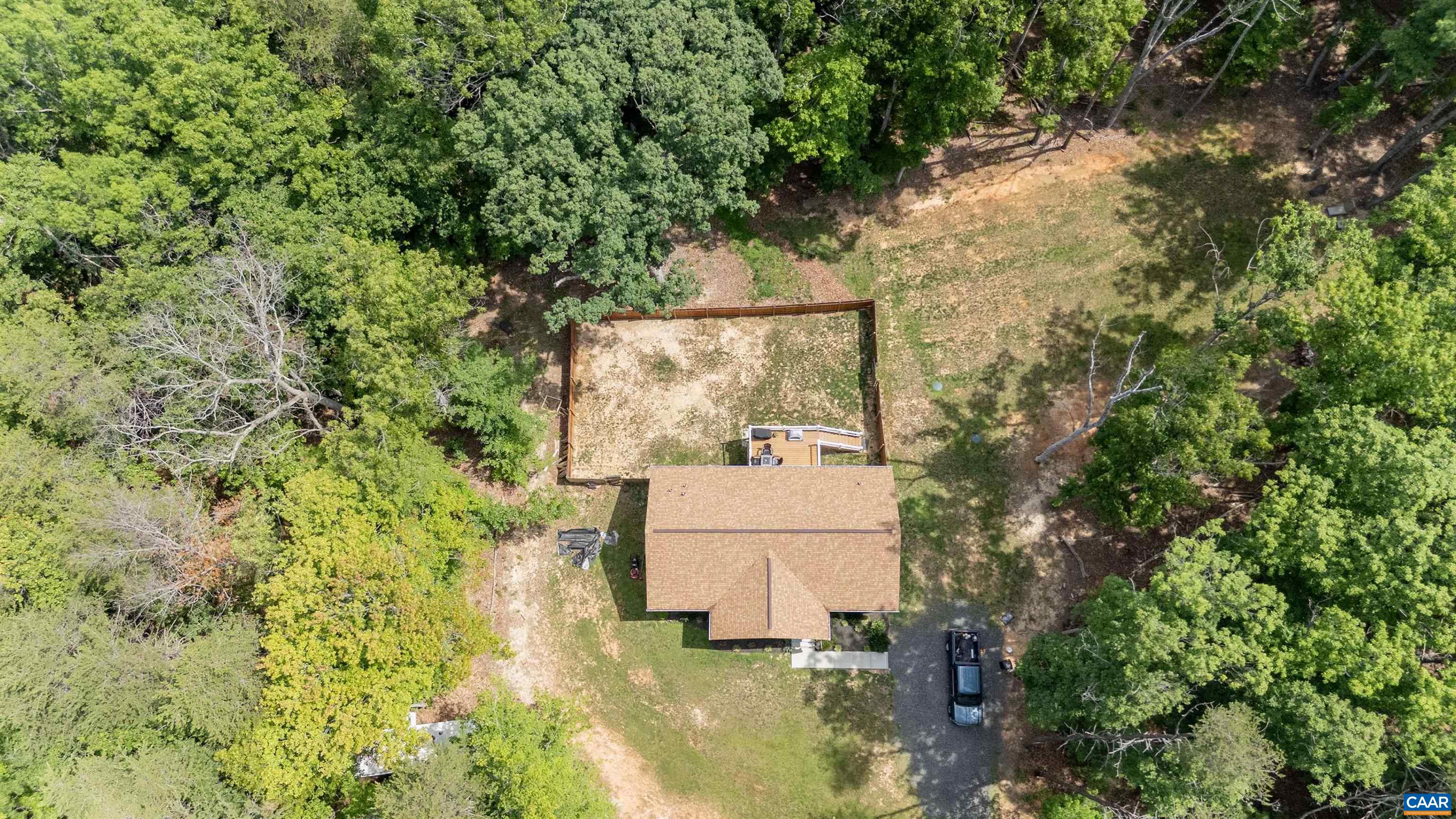 showing fenced backyard and drainfield area on right. showing fenced backyard and drainfield area on right.