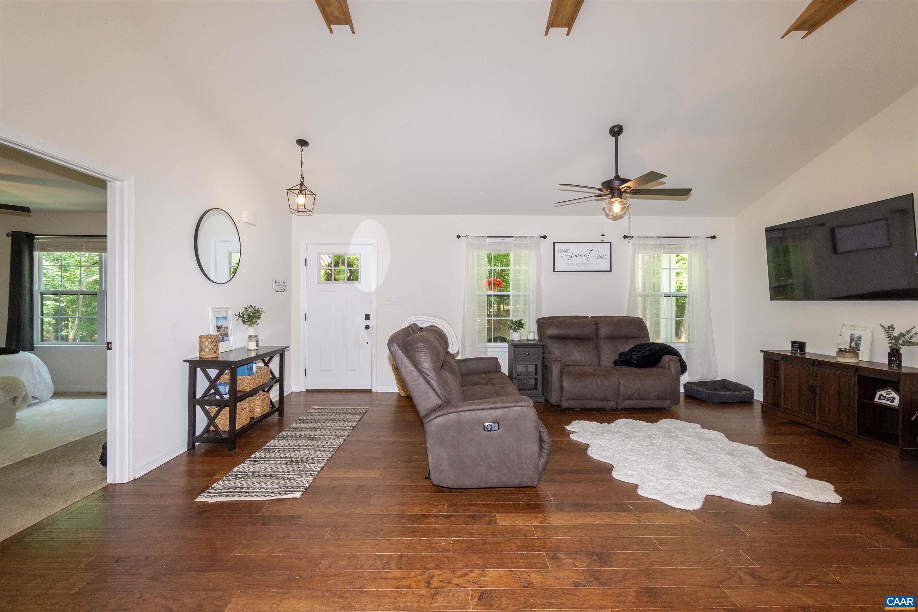 with vaulted ceiling and wide plank flooring. with vaulted ceiling and wide plank flooring.