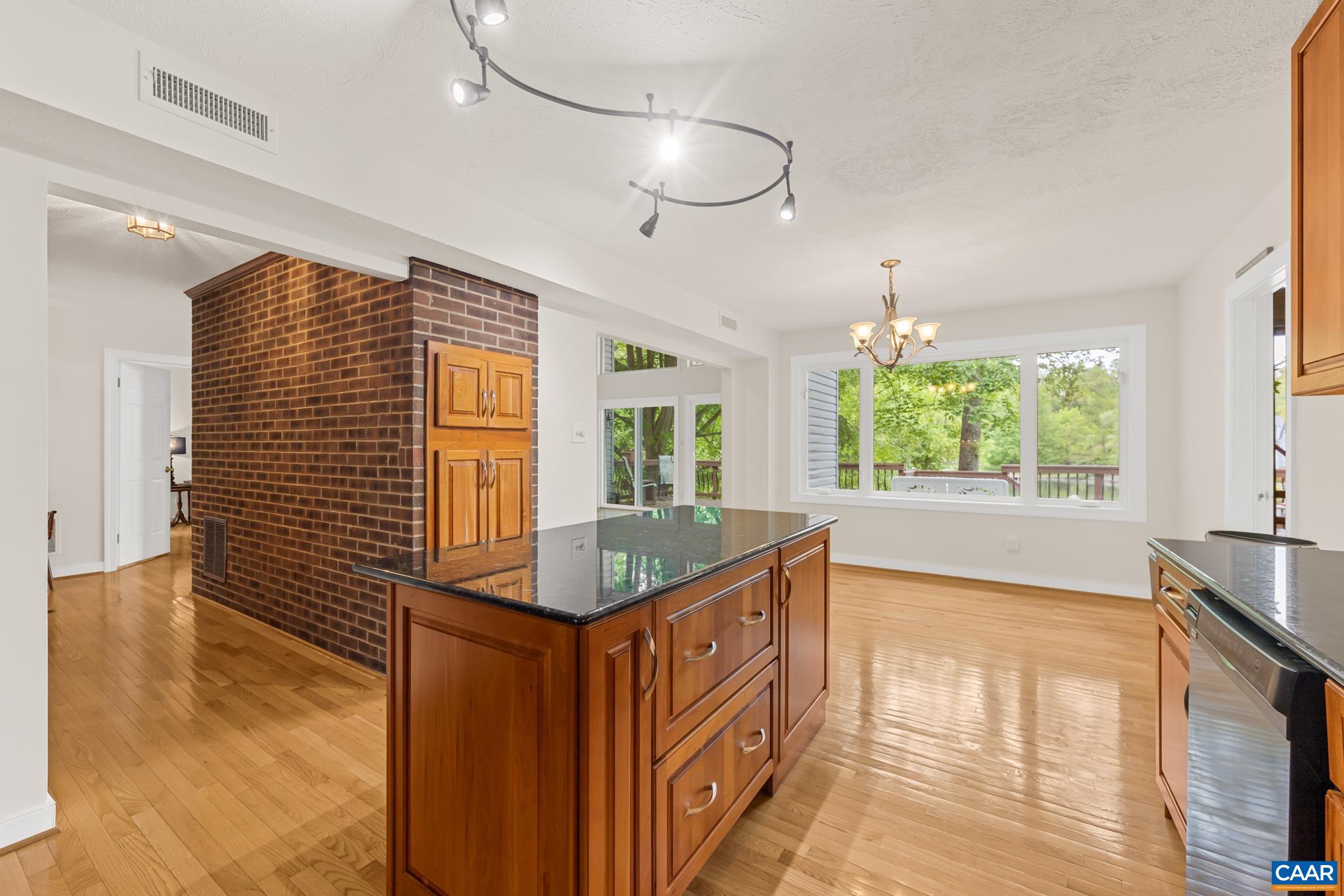 The kitchen features a large center island which provides extra prep space and invites family and guests to join in the cooking experience. The kitchen features a large center island which provides extra prep space and invites family and guests to join in the cooking experience.