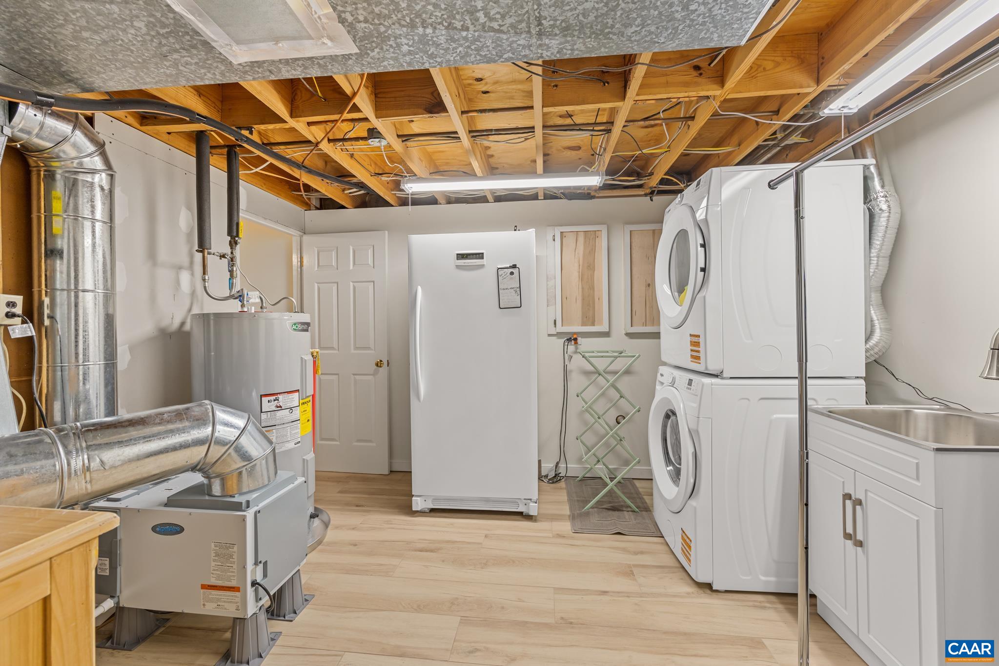 Mechanics room with Laundry room and utility sink Mechanics room with Laundry room and utility sink
