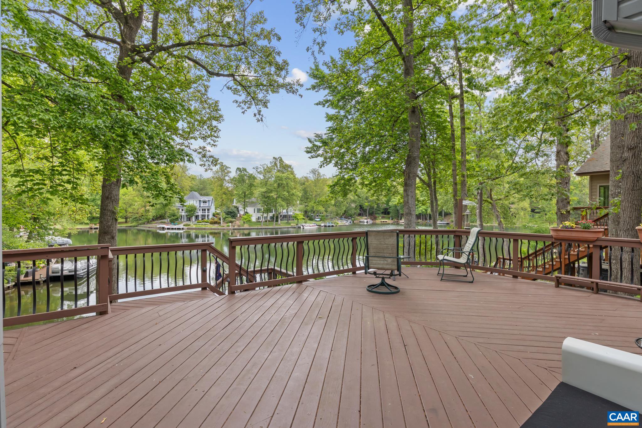 Generous exterior deck captures breathtaking lake views and overlooks the dock below, perfect for relaxing or entertaining. Generous exterior deck captures breathtaking lake views and overlooks the dock below, perfect for relaxing or entertaining.