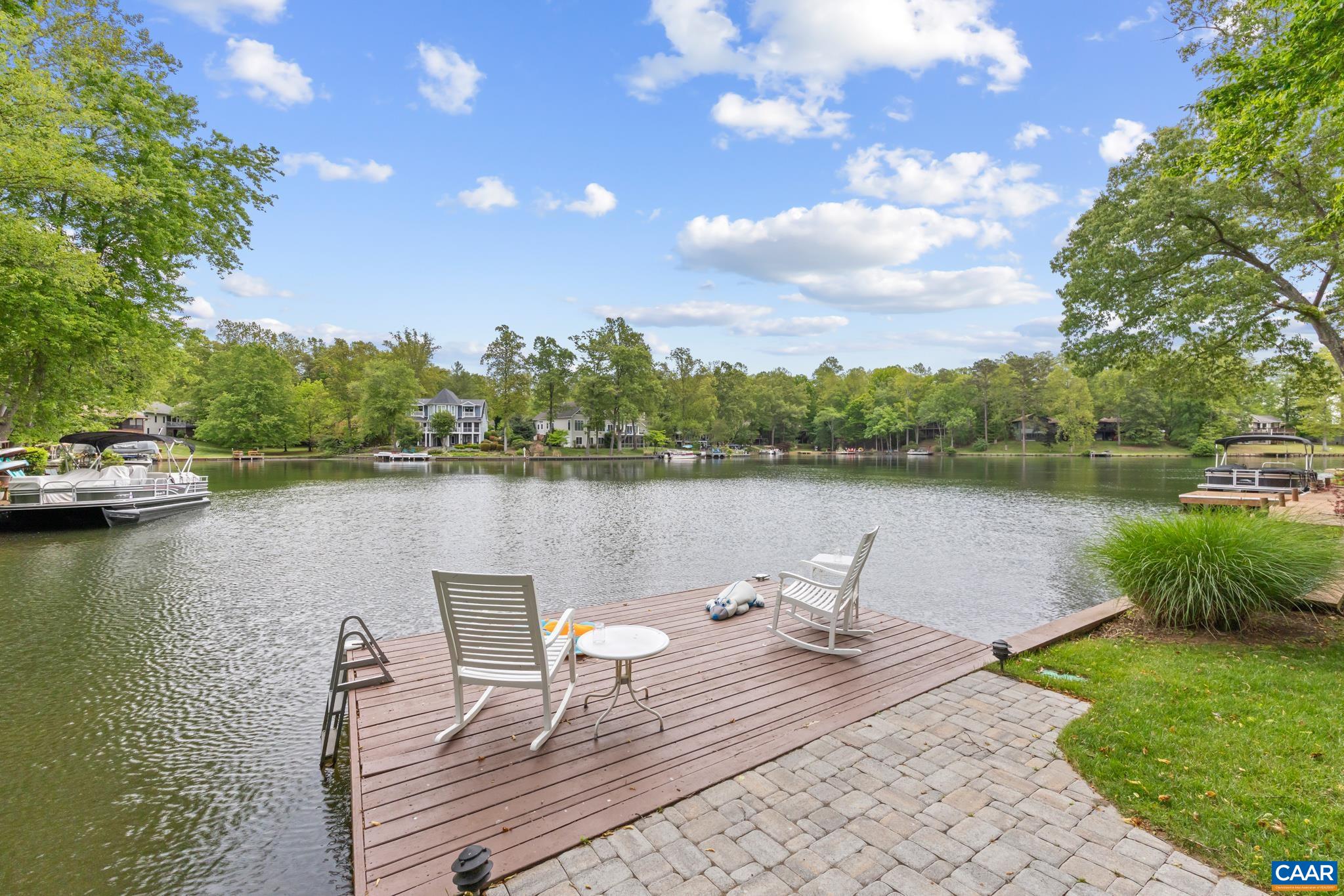 Step outside to direct water access and your own private dock. Perfect for boating, fishing and relaxing. Step outside to direct water access and your own private dock. Perfect for boating, fishing and relaxing.