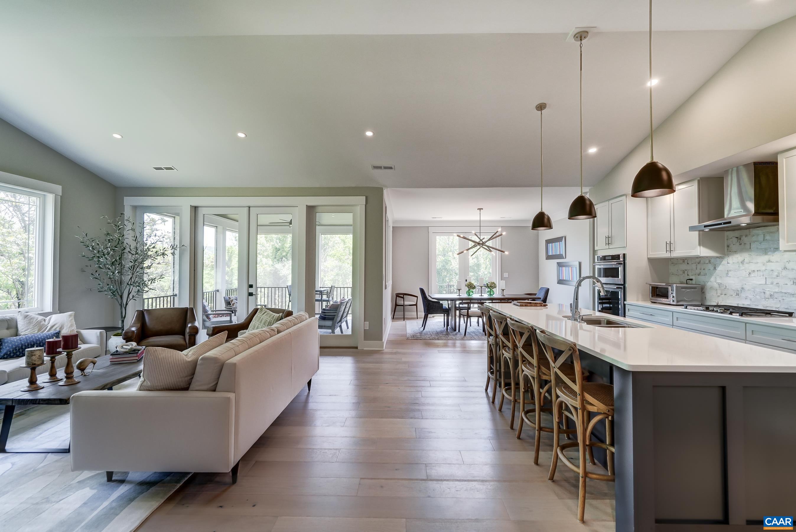 Vaulted great room flows into gourmet kitchen and dining area. Vaulted great room flows into gourmet kitchen and dining area.