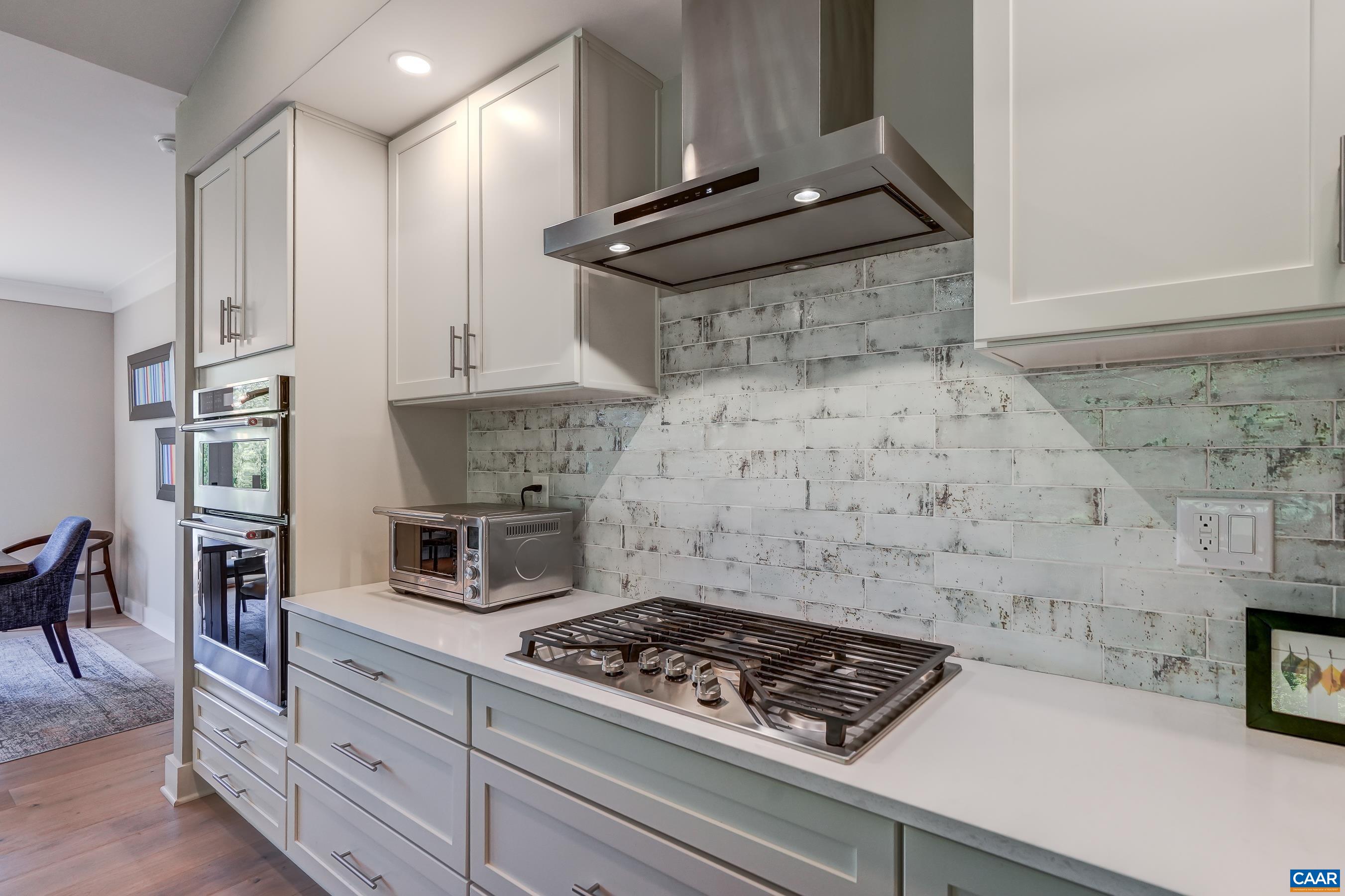 Gas cooktop with subway tile backsplash. Gas cooktop with subway tile backsplash.