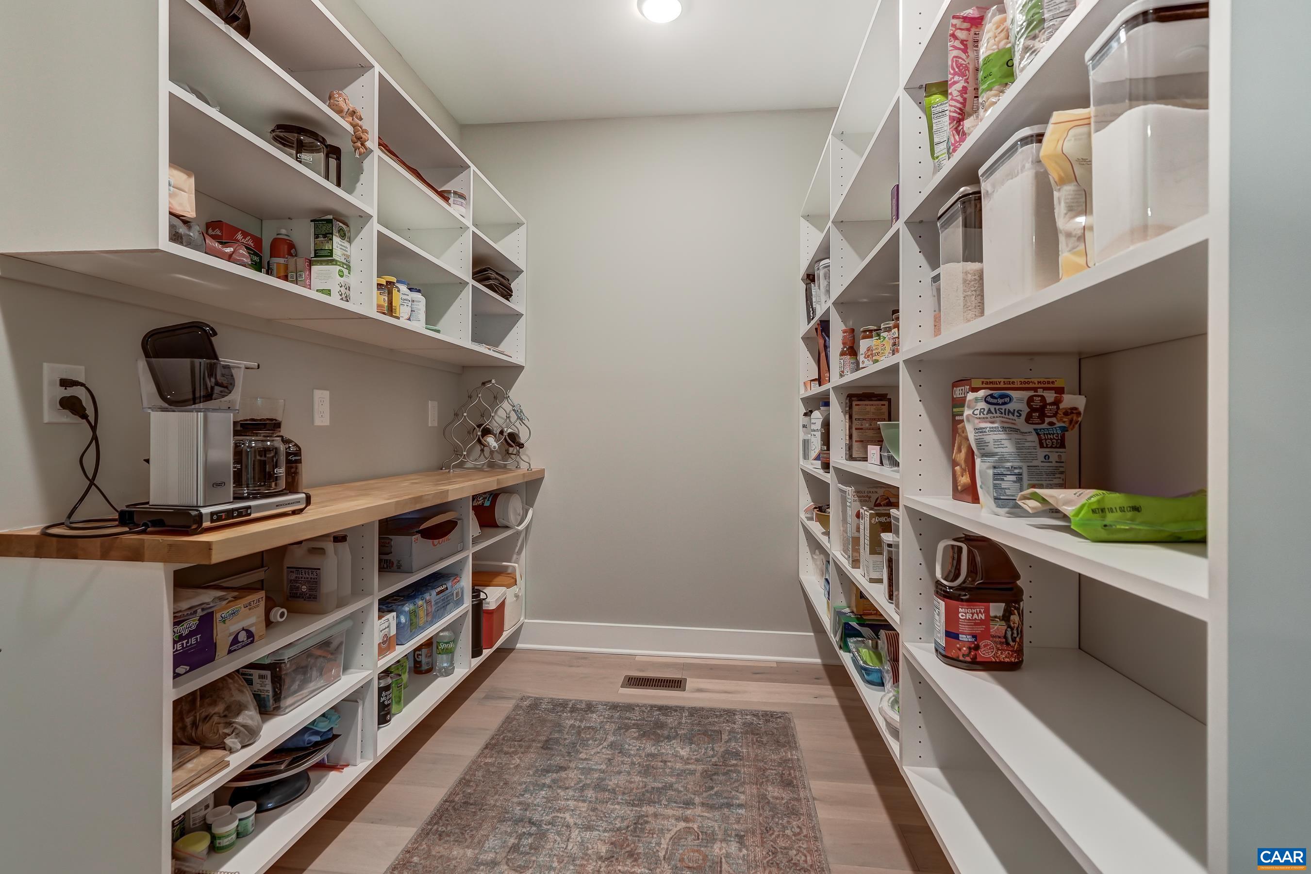Large walk in pantry with wood countertop area for storing small appliances out of sight! Large walk in pantry with wood countertop area for storing small appliances out of sight!