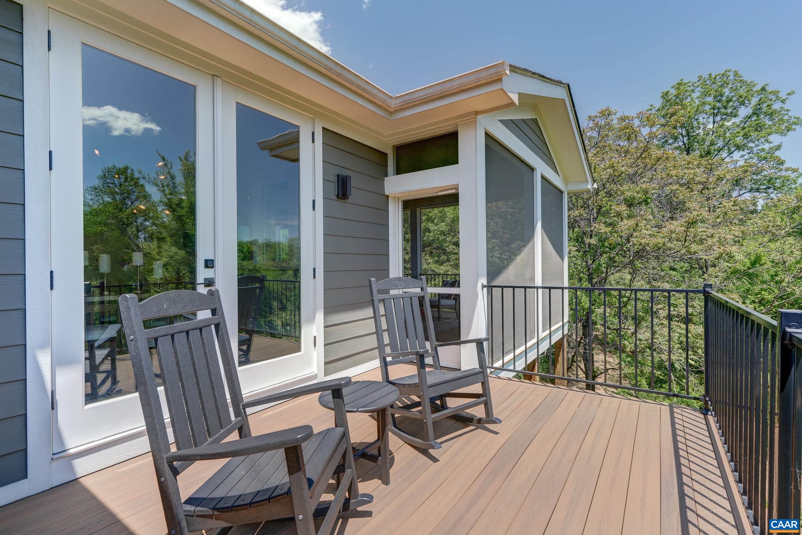 Screened porch leads to open deck with dining room access - a perfect spot for grilling and outdoor dining! Screened porch leads to open deck with dining room access - a perfect spot for grilling and outdoor dining!