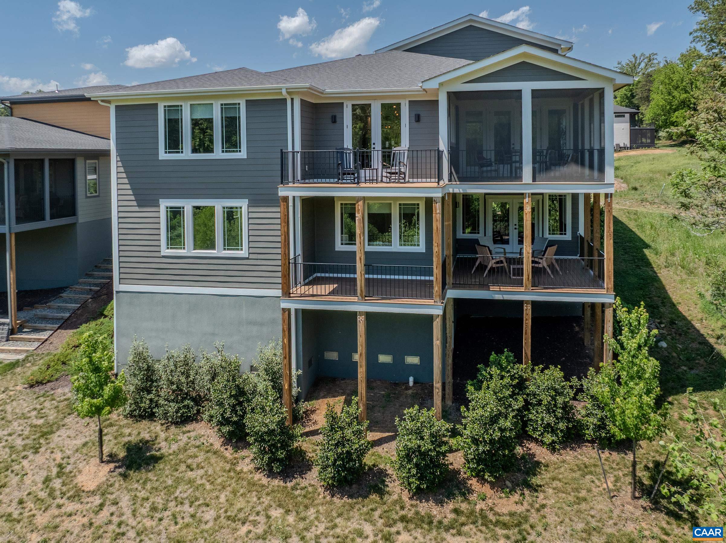 Two levels of outdoor living spaces with screened porches and open air decks. Two levels of outdoor living spaces with screened porches and open air decks.