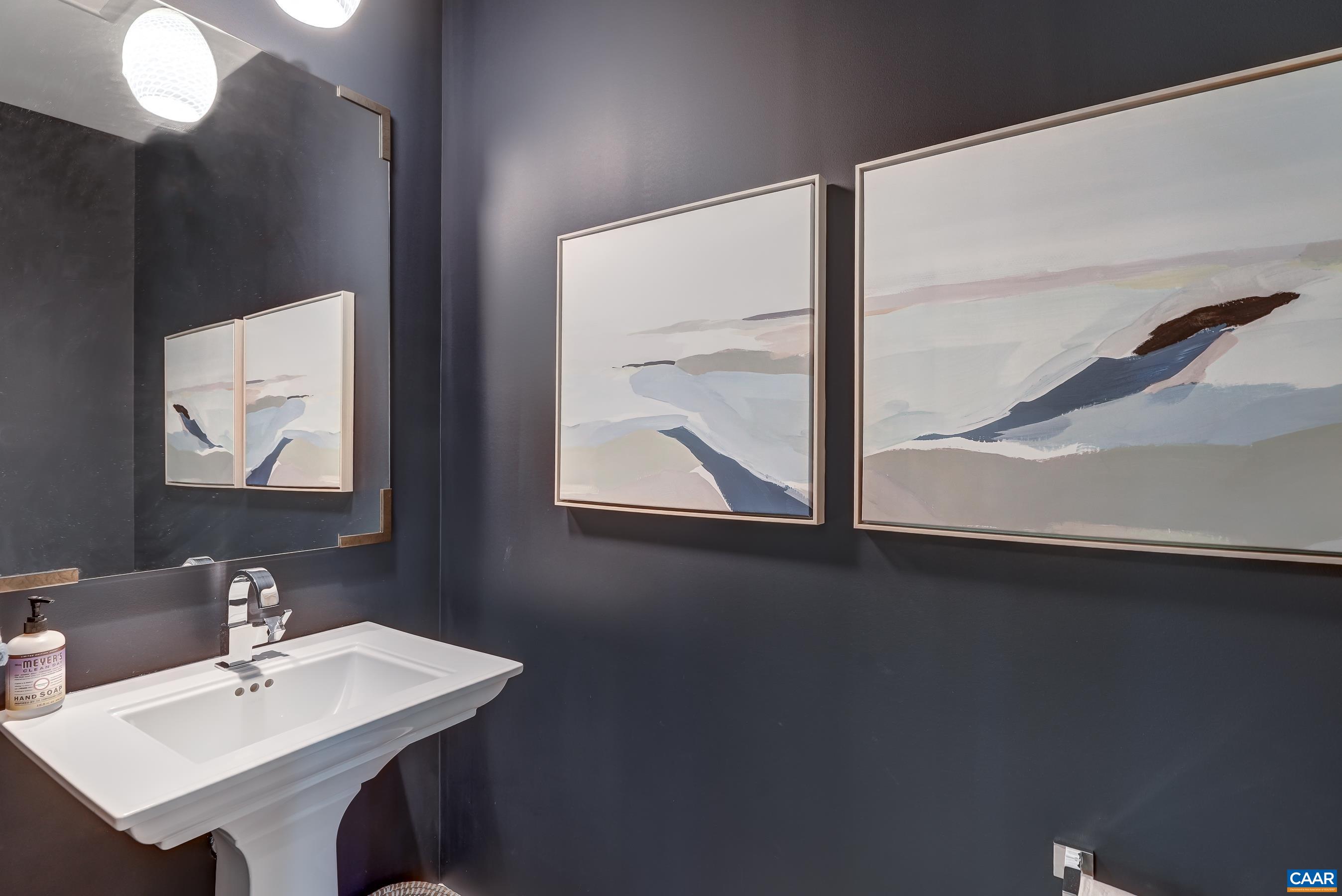 Powder room with pedestal sink. Powder room with pedestal sink.