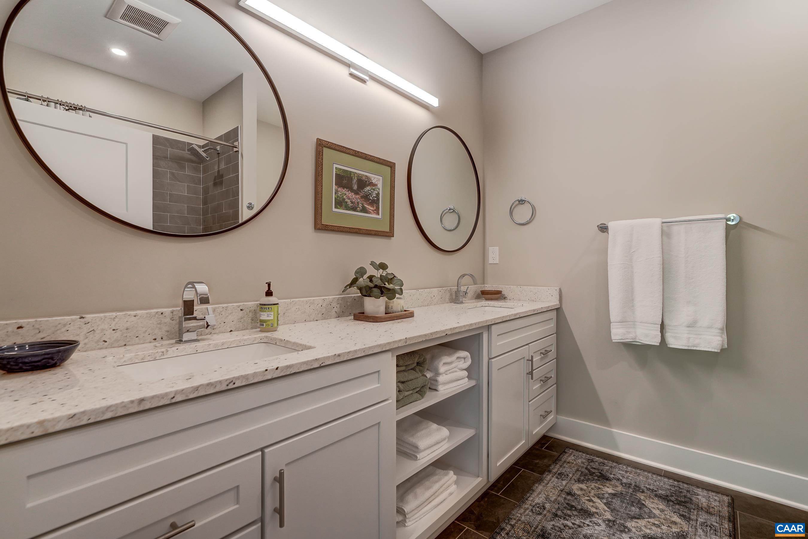 Large full bathroom with two sinks and so much counter space. Large full bathroom with two sinks and so much counter space.