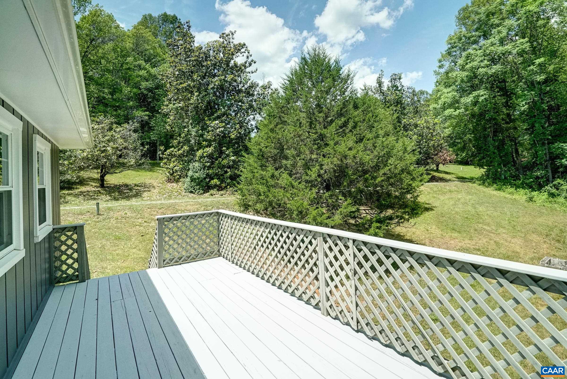 Great deck overlooking the beautiful private yard. Great deck overlooking the beautiful private yard.