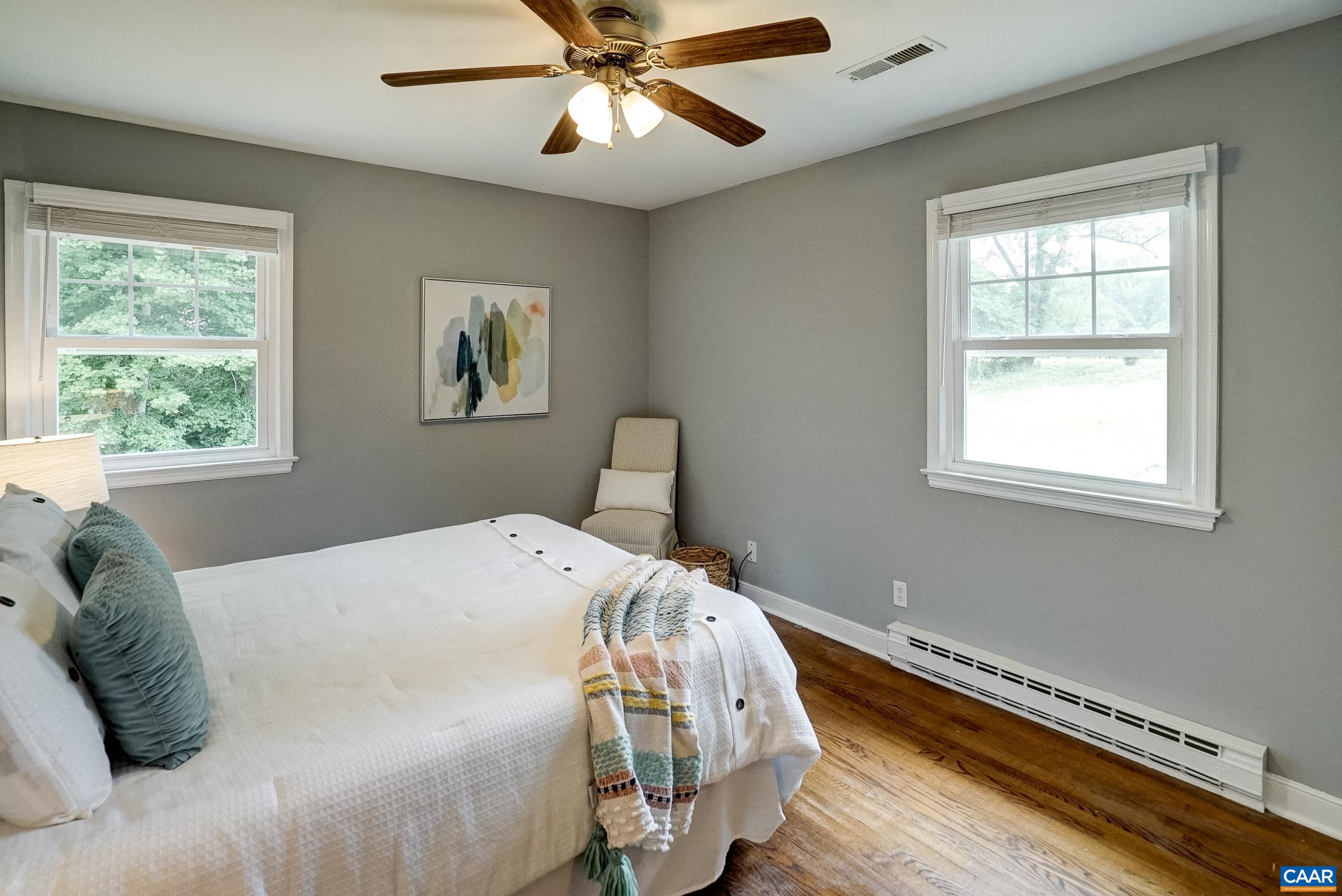 Primary bedroom with ceiling fan. Primary bedroom with ceiling fan.