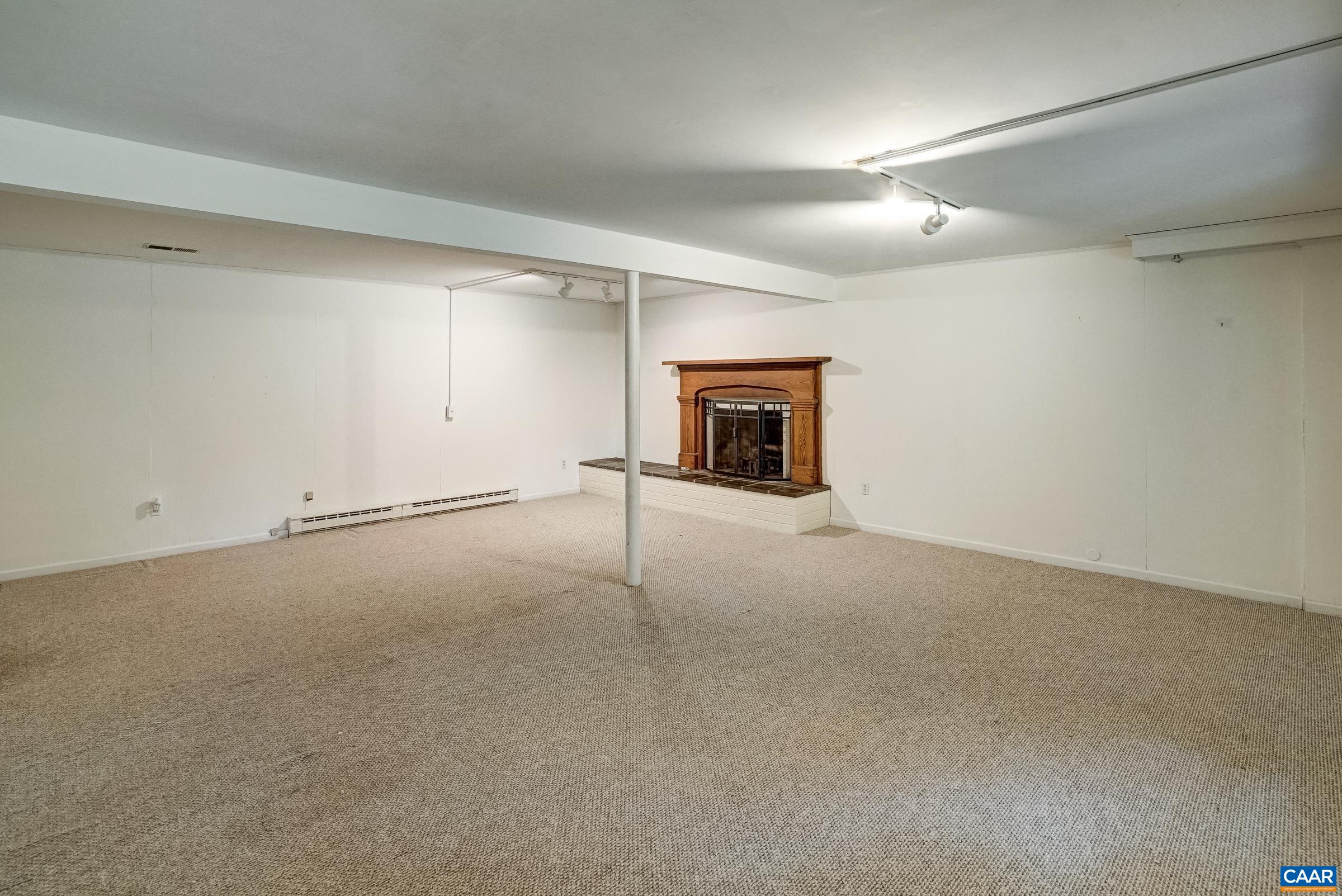 Walk-out basement features a large rec room with brick fireplace. Walk-out basement features a large rec room with brick fireplace.