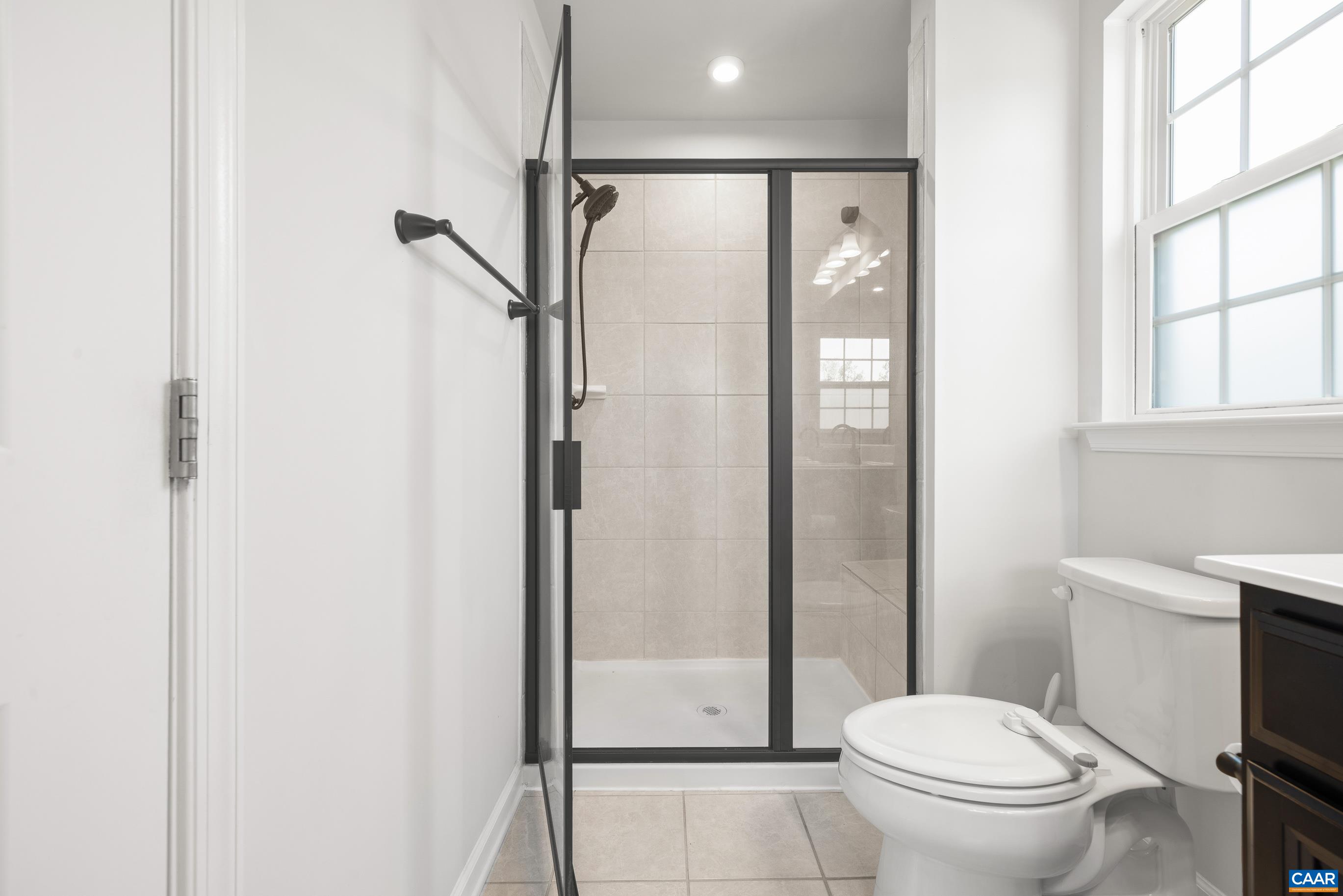 Updated shower with tile and seat Updated shower with tile and seat