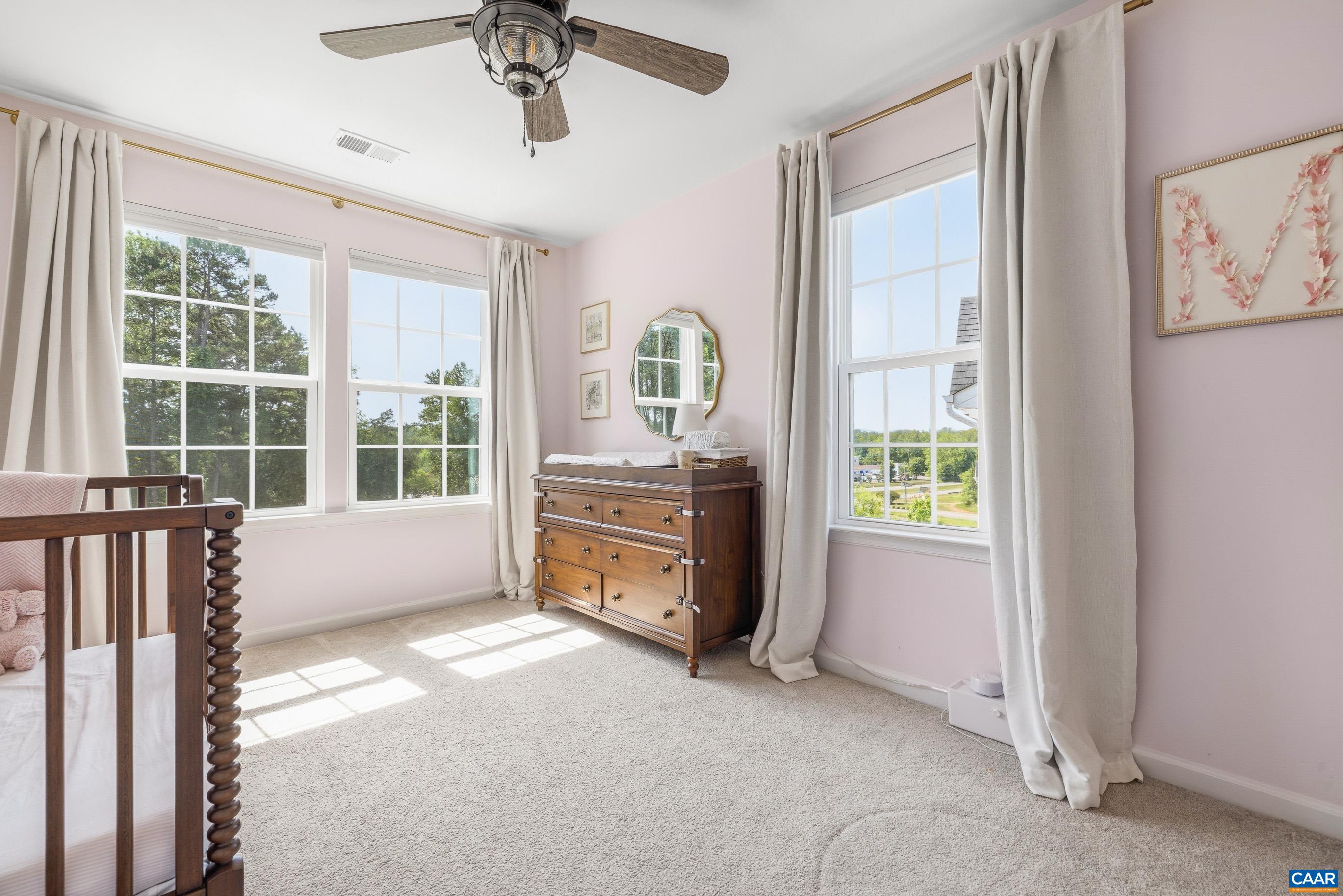 Light filled bedroom with walk in closet Light filled bedroom with walk in closet