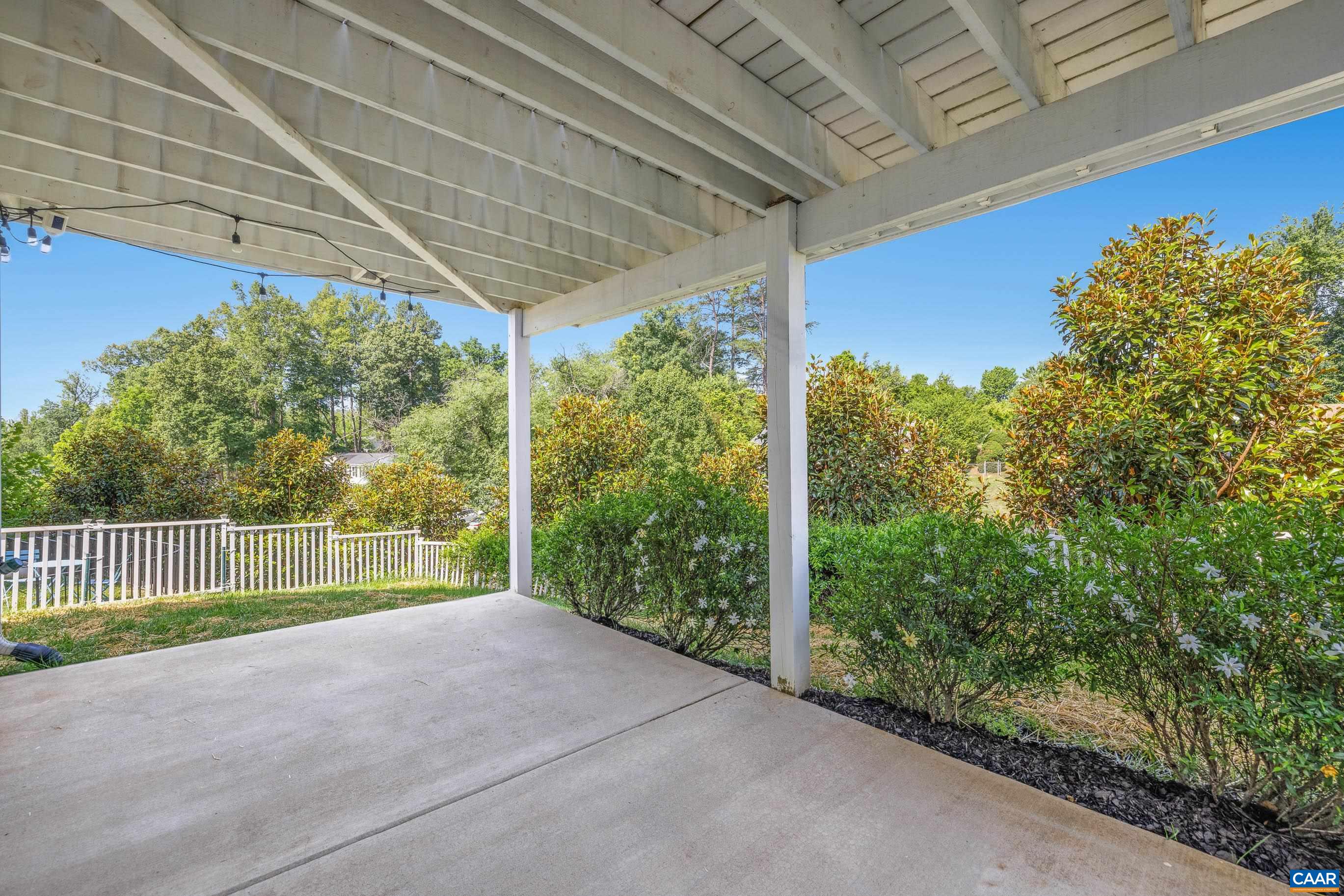 lower level patio with fenced in yard and privacy trees lower level patio with fenced in yard and privacy trees