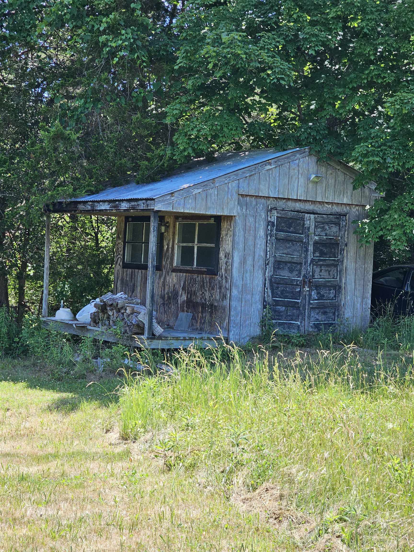 Use your imagination. Rustic shed with a little front porch.