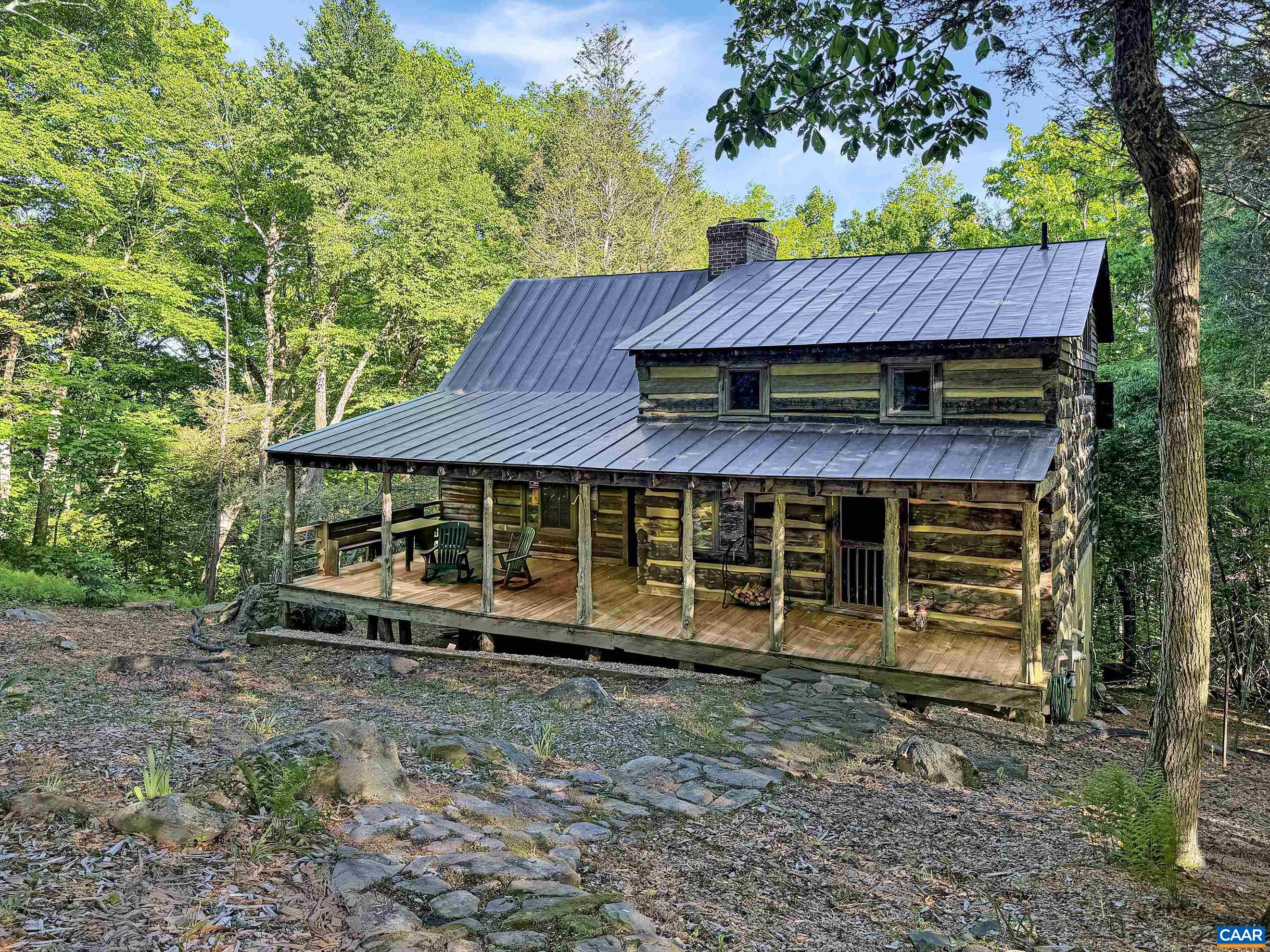 Rich in history and craftsmanship, this unique cabin was reconstructed in 2000 using reclaimed elements from antique buildings dating to the 1800s, creating a one-of-a-kind mountain retreat. Rich in history and craftsmanship, this unique cabin was reconstructed in 2000 using reclaimed elements from antique buildings dating to the 1800s, creating a one-of-a-kind mountain retreat.
