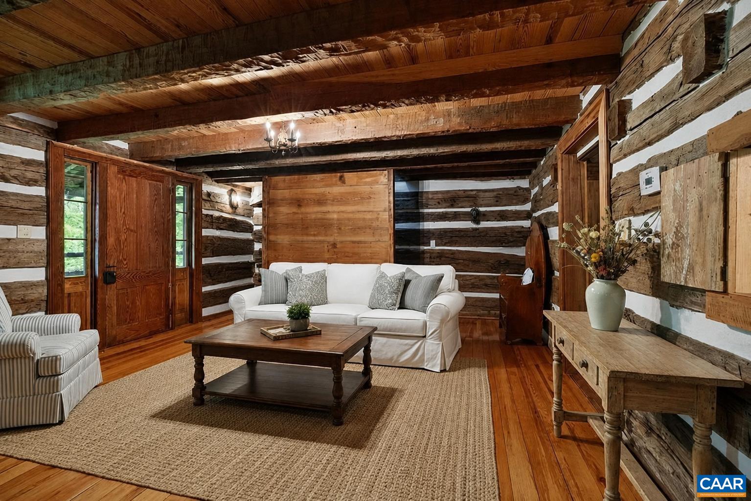 Cozy Living Room on the main level. The photo has been virtually staged. Cozy Living Room on the main level. The photo has been virtually staged.
