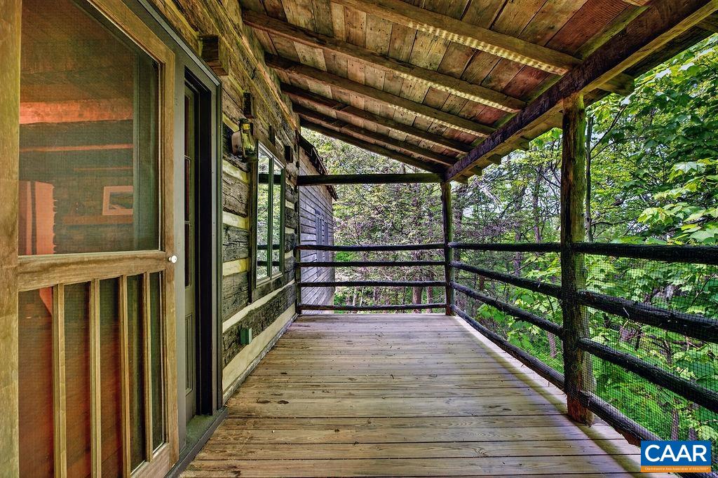 Back porch off of the main level living room. Back porch off of the main level living room.