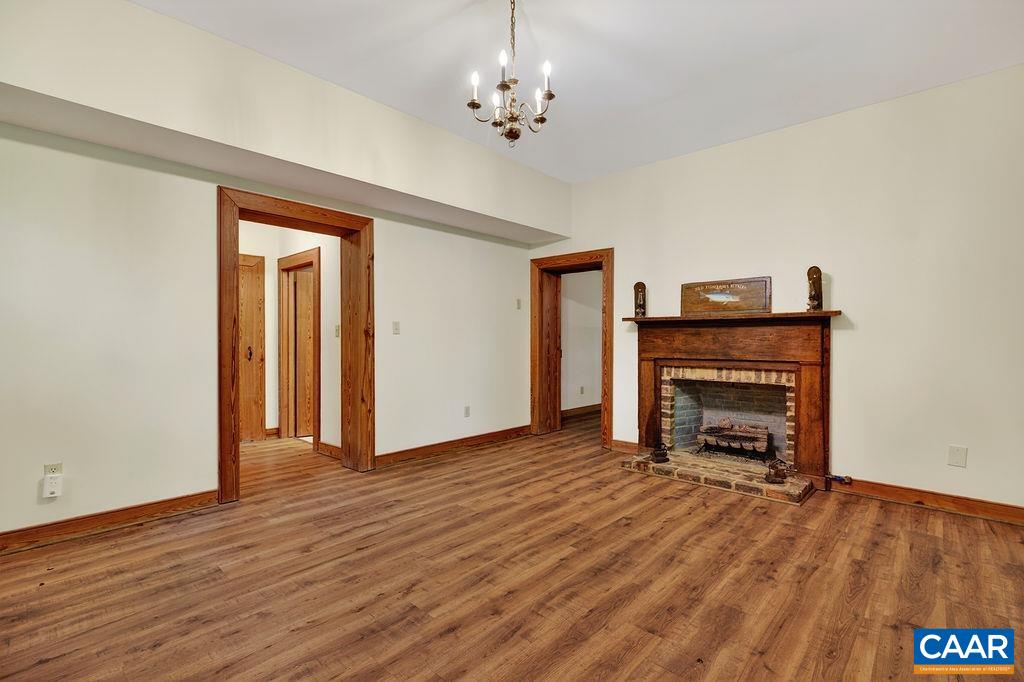 The spacious Family Room on the lower level features beautiful new LVP floors and a gas logs fireplace. The spacious Family Room on the lower level features beautiful new LVP floors and a gas logs fireplace.