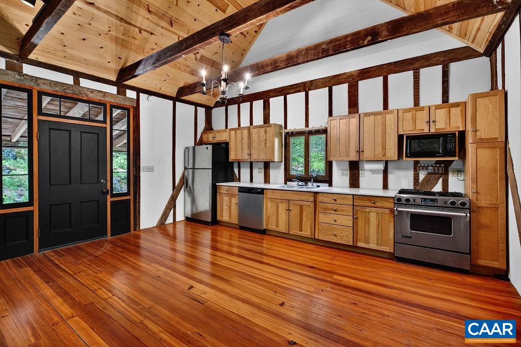 Rich in local history, the kitchen is housed within a historic structure that was moved from another area of Nelson County and meticulously reconstructed on the property, creating a truly one-of-a-kind space. Rich in local history, the kitchen is housed within a historic structure that was moved from another area of Nelson County and meticulously reconstructed on the property, creating a truly one-of-a-kind space.