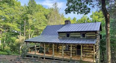 Rich in history and craftsmanship, this unique cabin was reconstructed in 2000 using reclaimed elements from antique buildings dating to the 1800s, creating a one-of-a-kind mountain retreat.