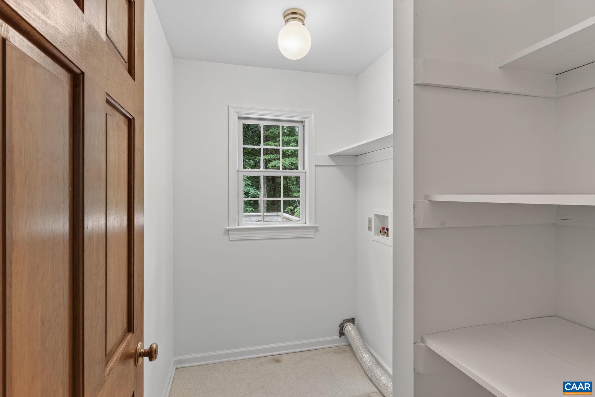 Laundry room with storage off the kitchen.