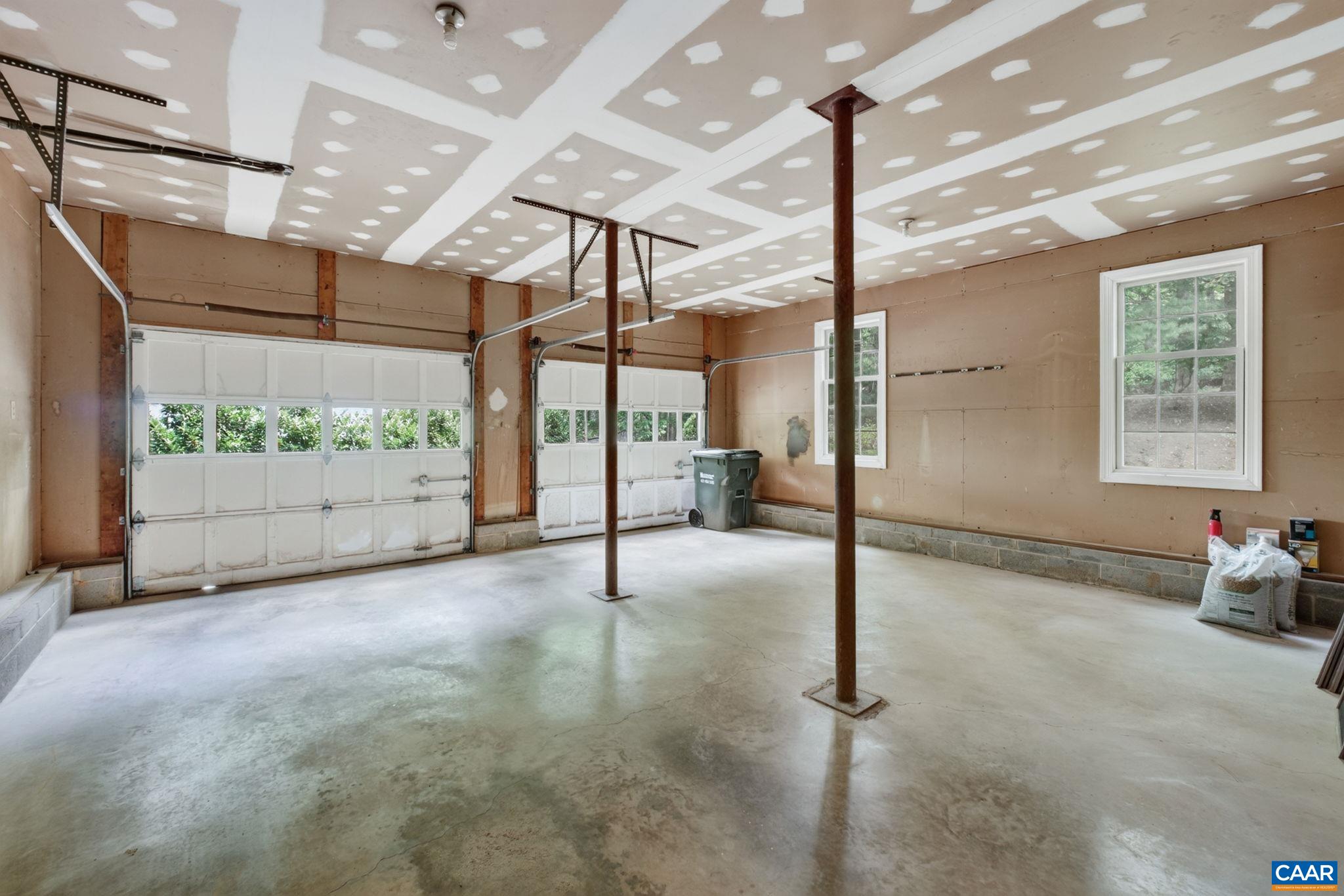 Two-car garage includes an entrance through the kitchen.