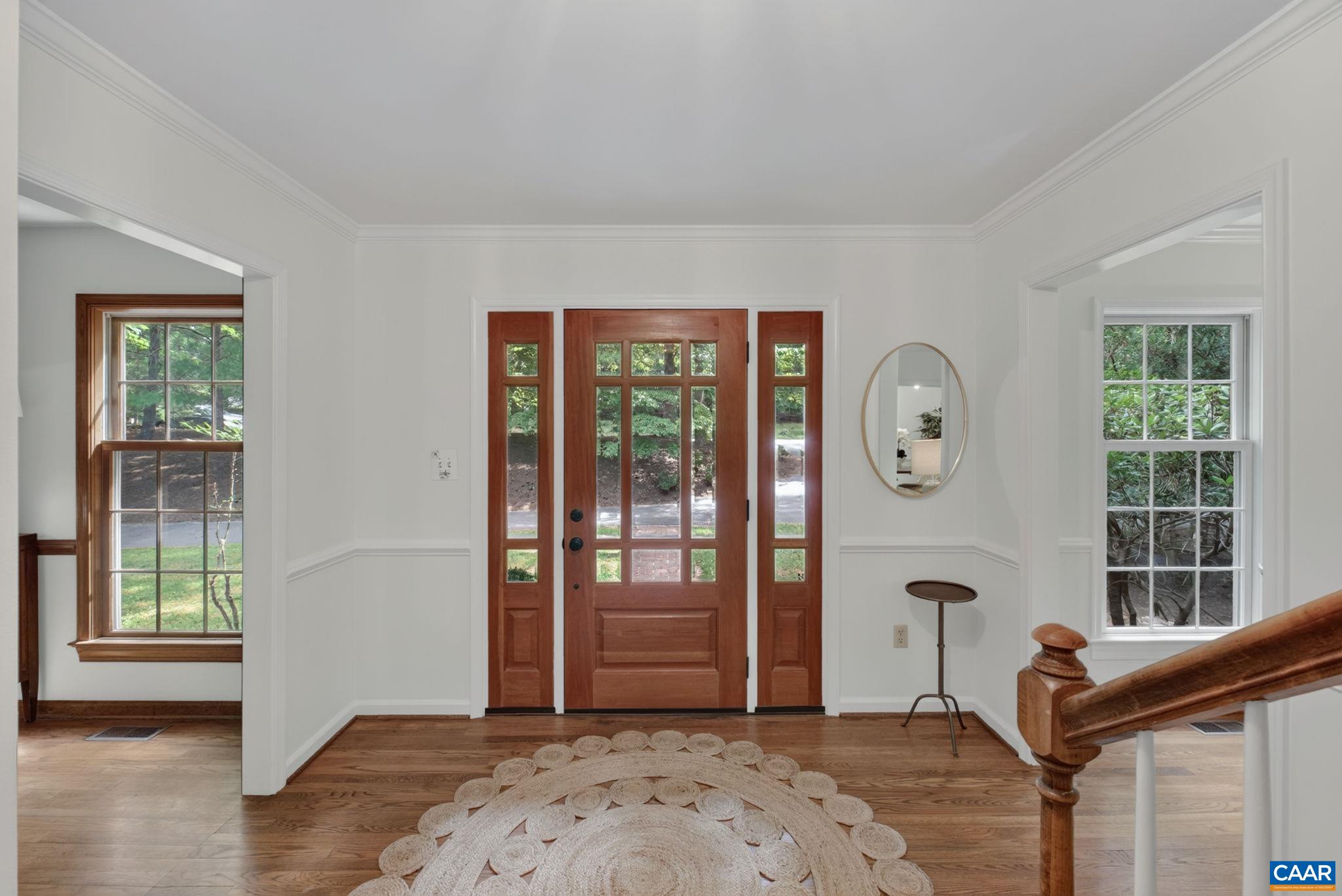 Bright foyer leading to the living room & family room.