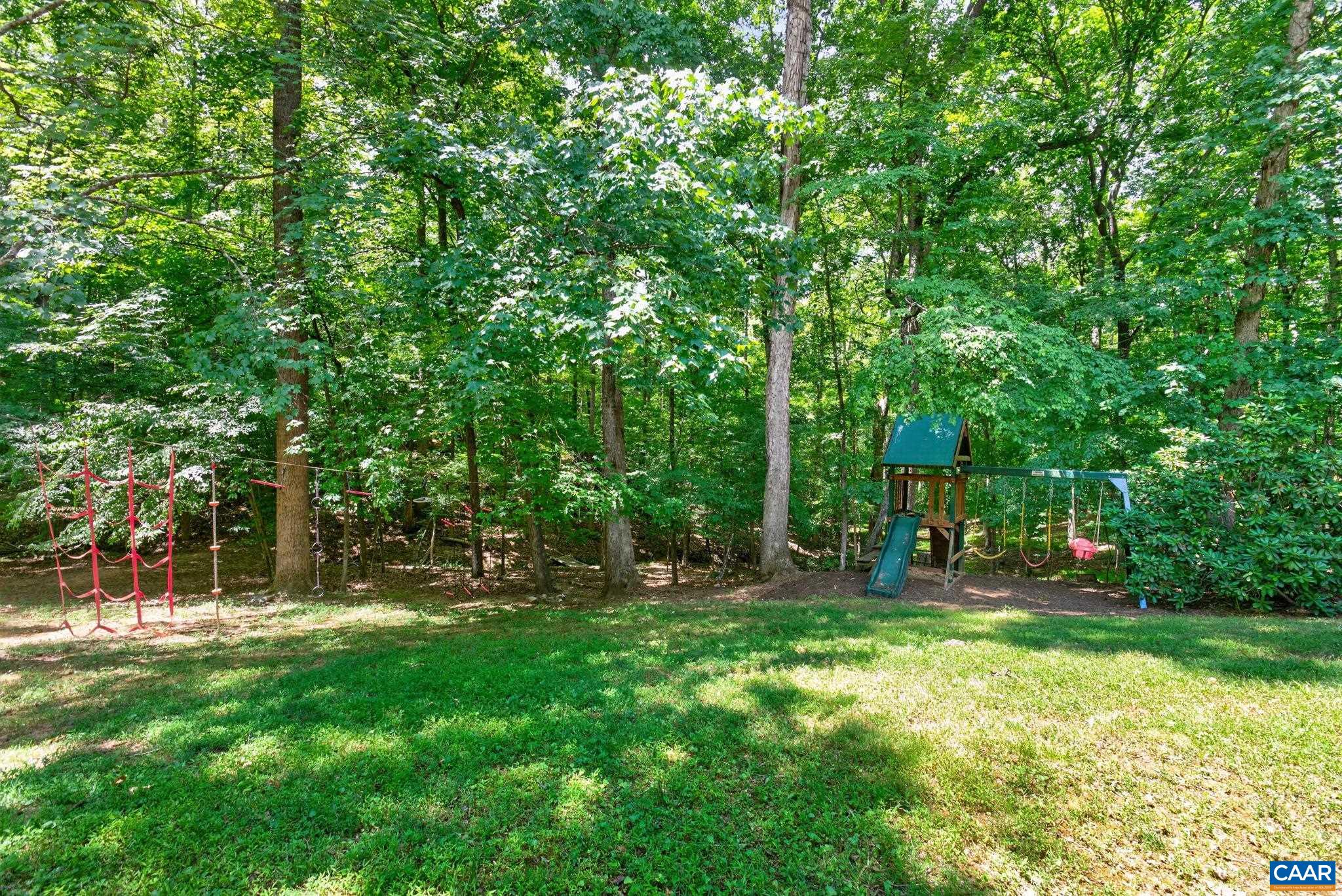 Behind the playset, you'll find a path for exploring the rest of the property.