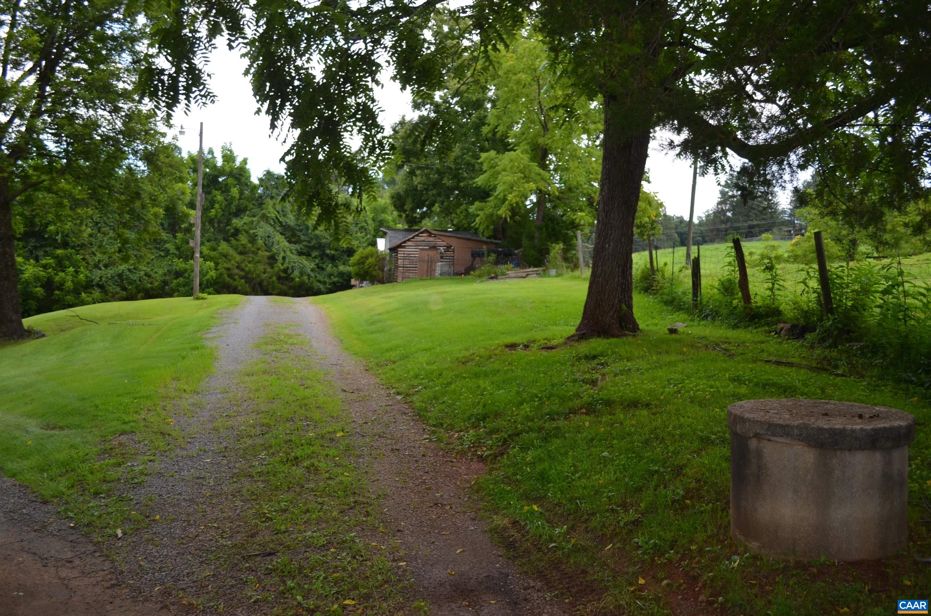 Front of Log cabin, storage shed and workshop
