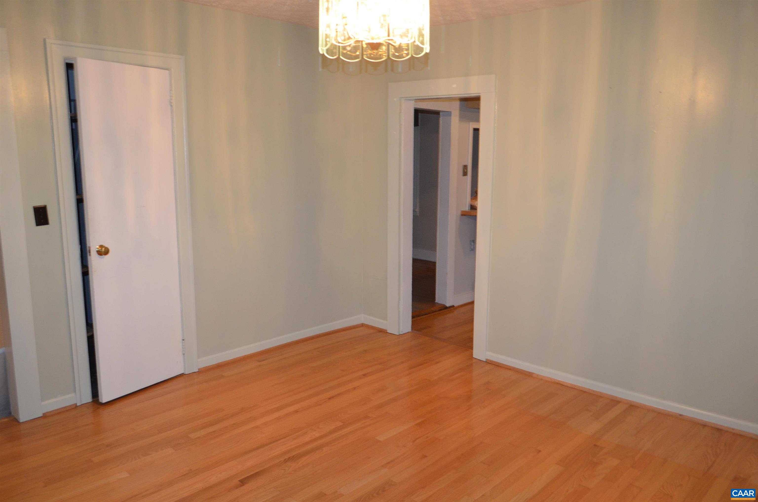 Pantry under stairway looking towards kitchen