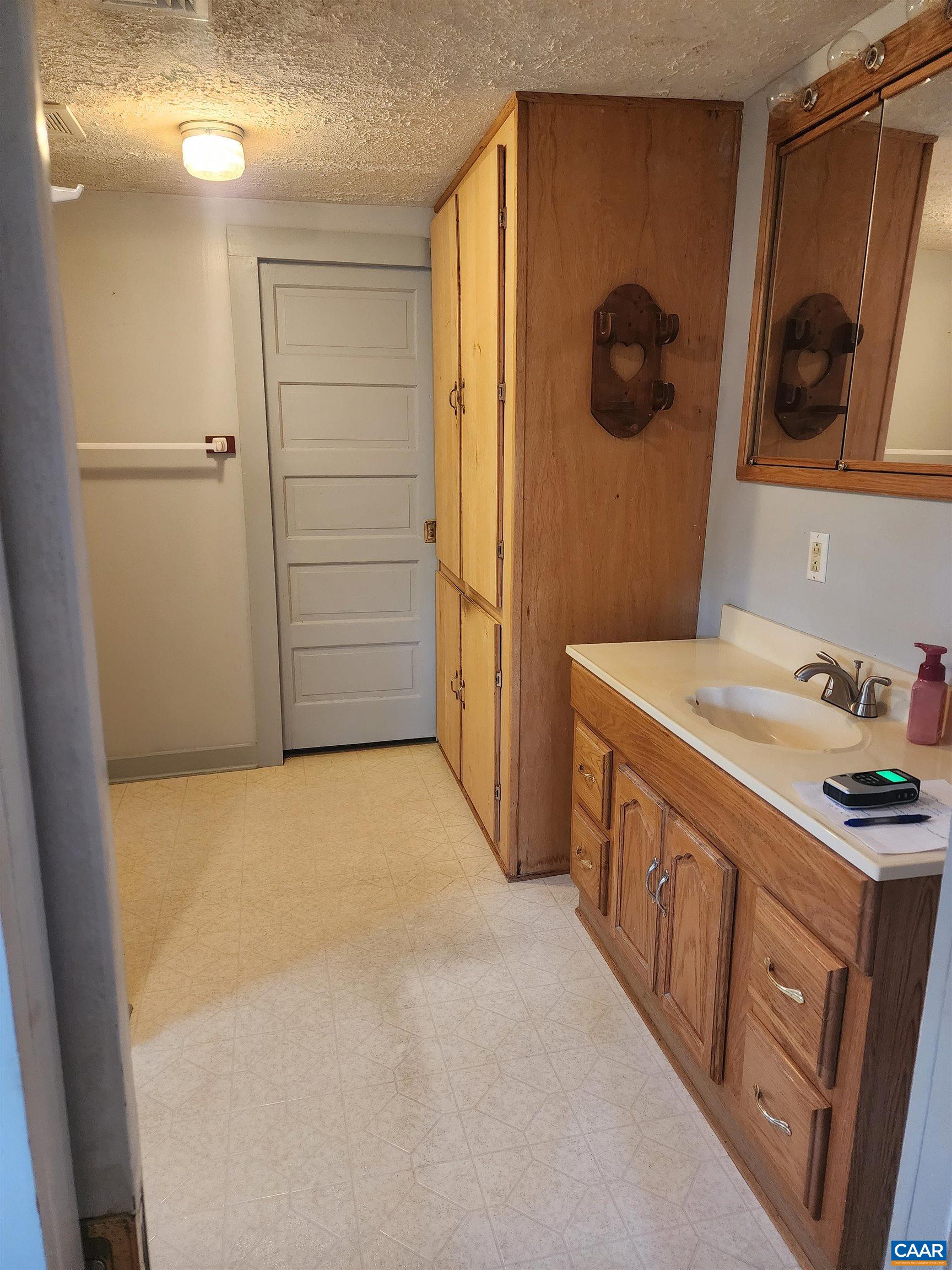 Features Pocket door entry from Primary Bedroom and into walk-in Closet